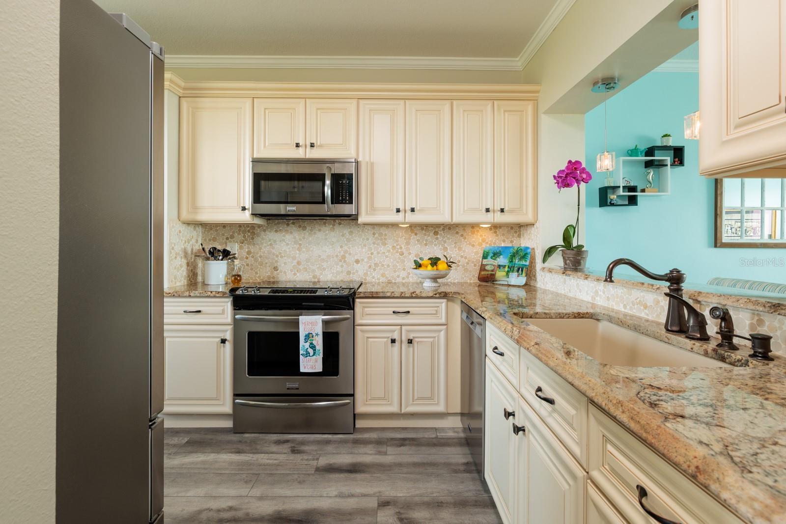 Remodeled kitchen with newer appliances.