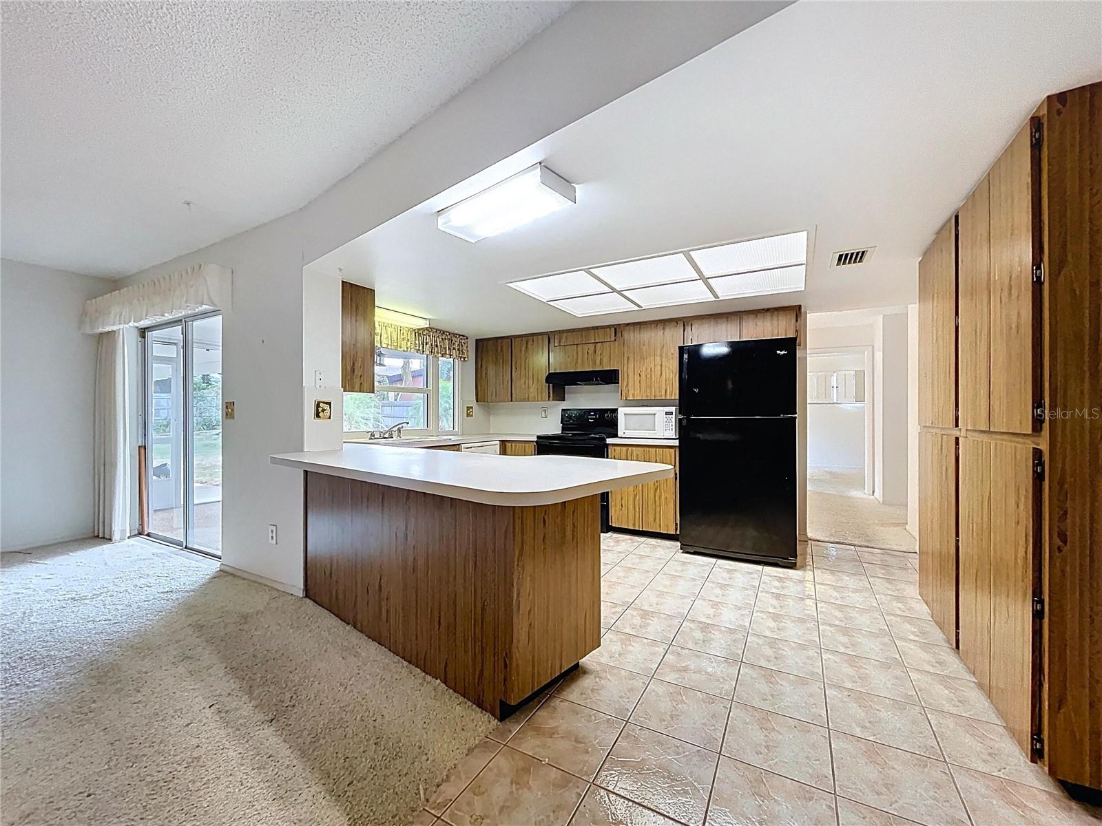 Kitchen offers a closet pantry and plenty of cabinet space.