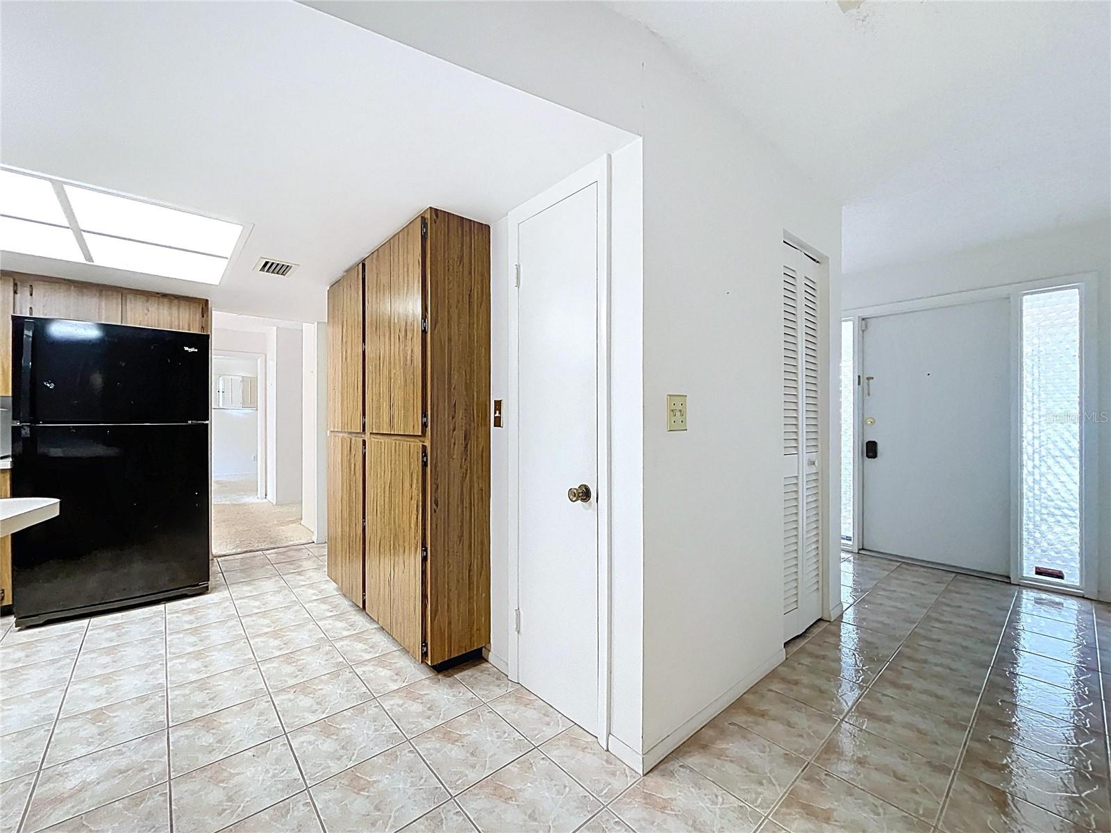Kitchen offers a closet pantry and plenty of cabinet space.