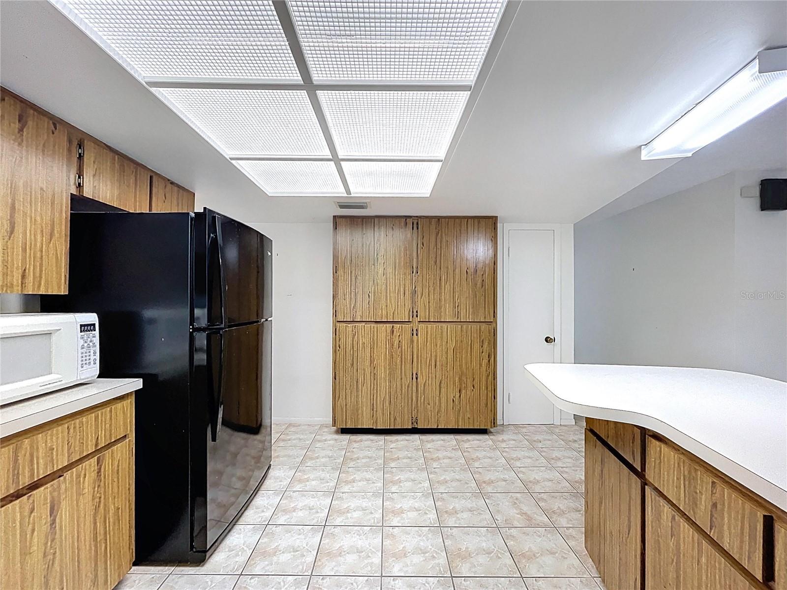 Kitchen offers a closet pantry and plenty of cabinet space.