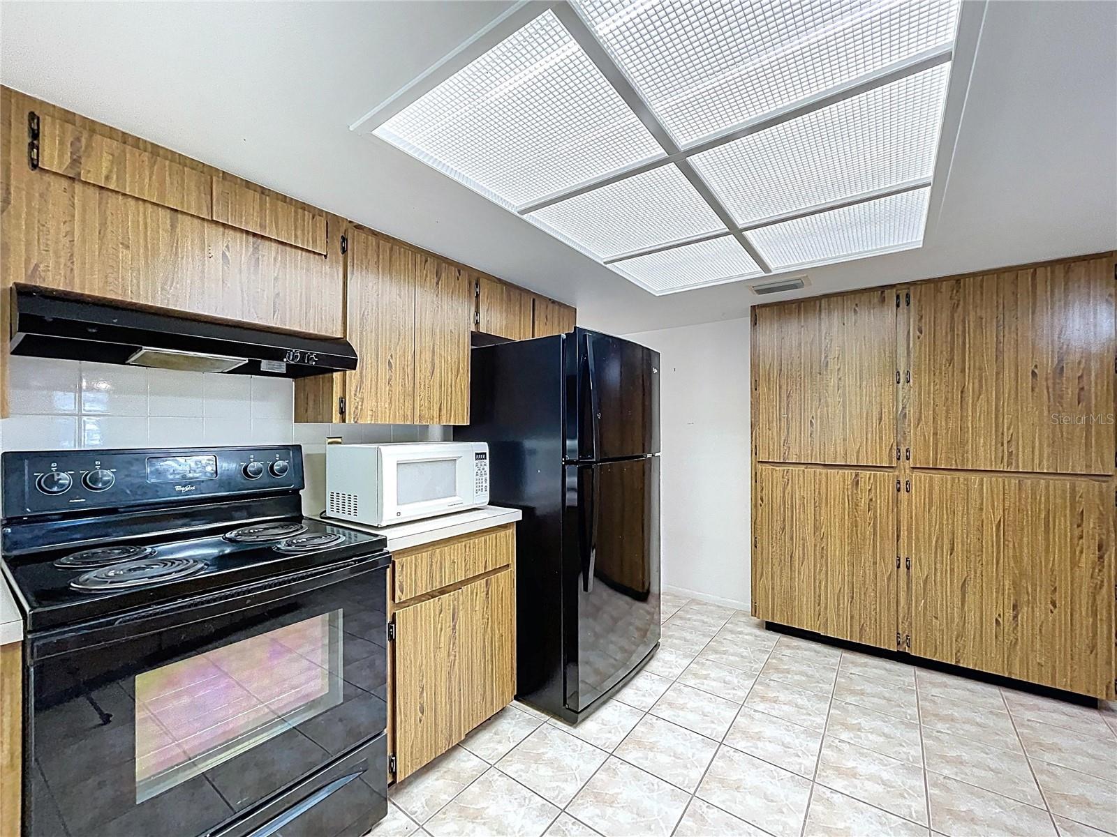 Kitchen offers a closet pantry and plenty of cabinet space.