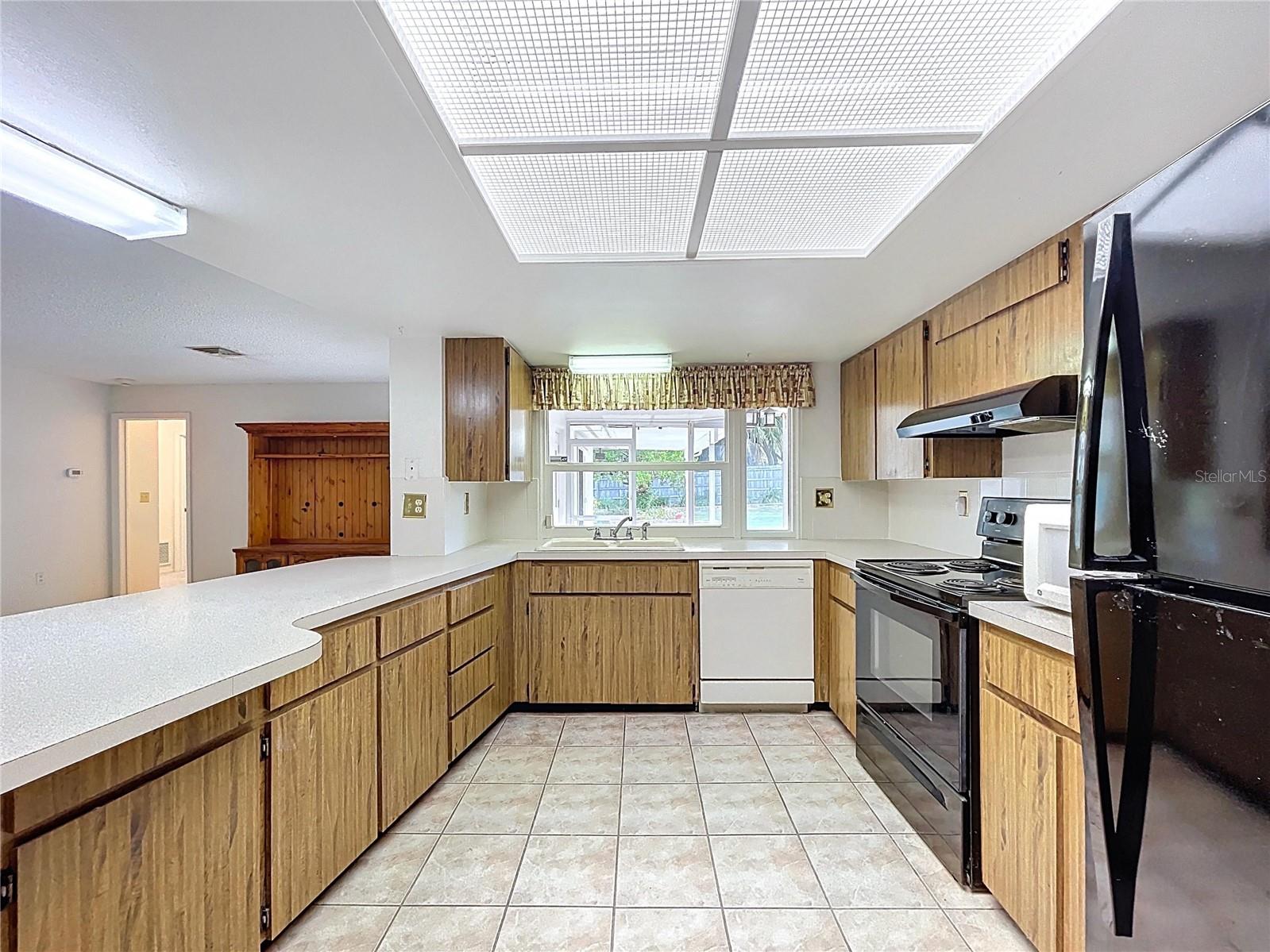 Kitchen offers a closet pantry and plenty of cabinet space.