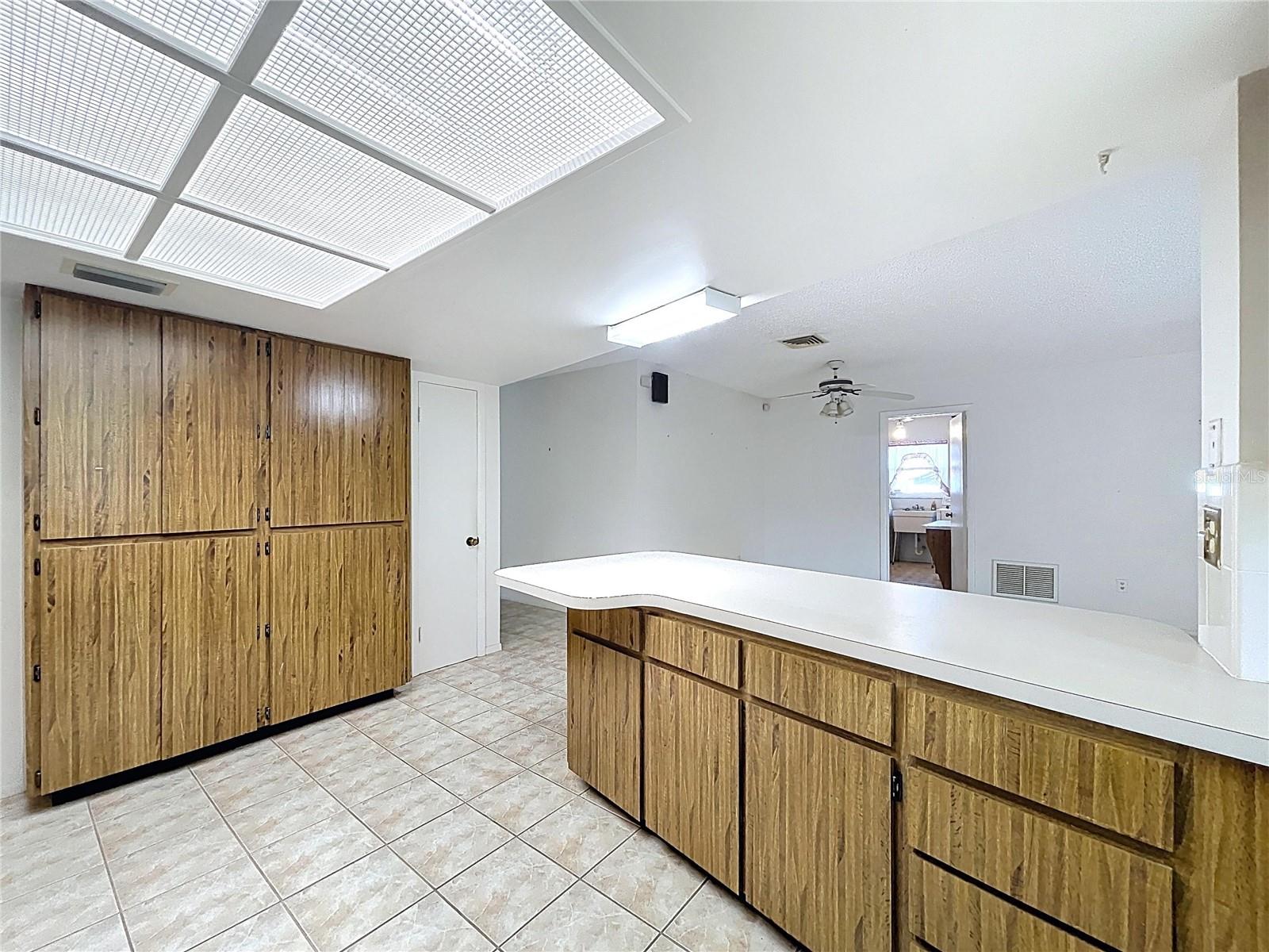 Kitchen offers a closet pantry and plenty of cabinet space.