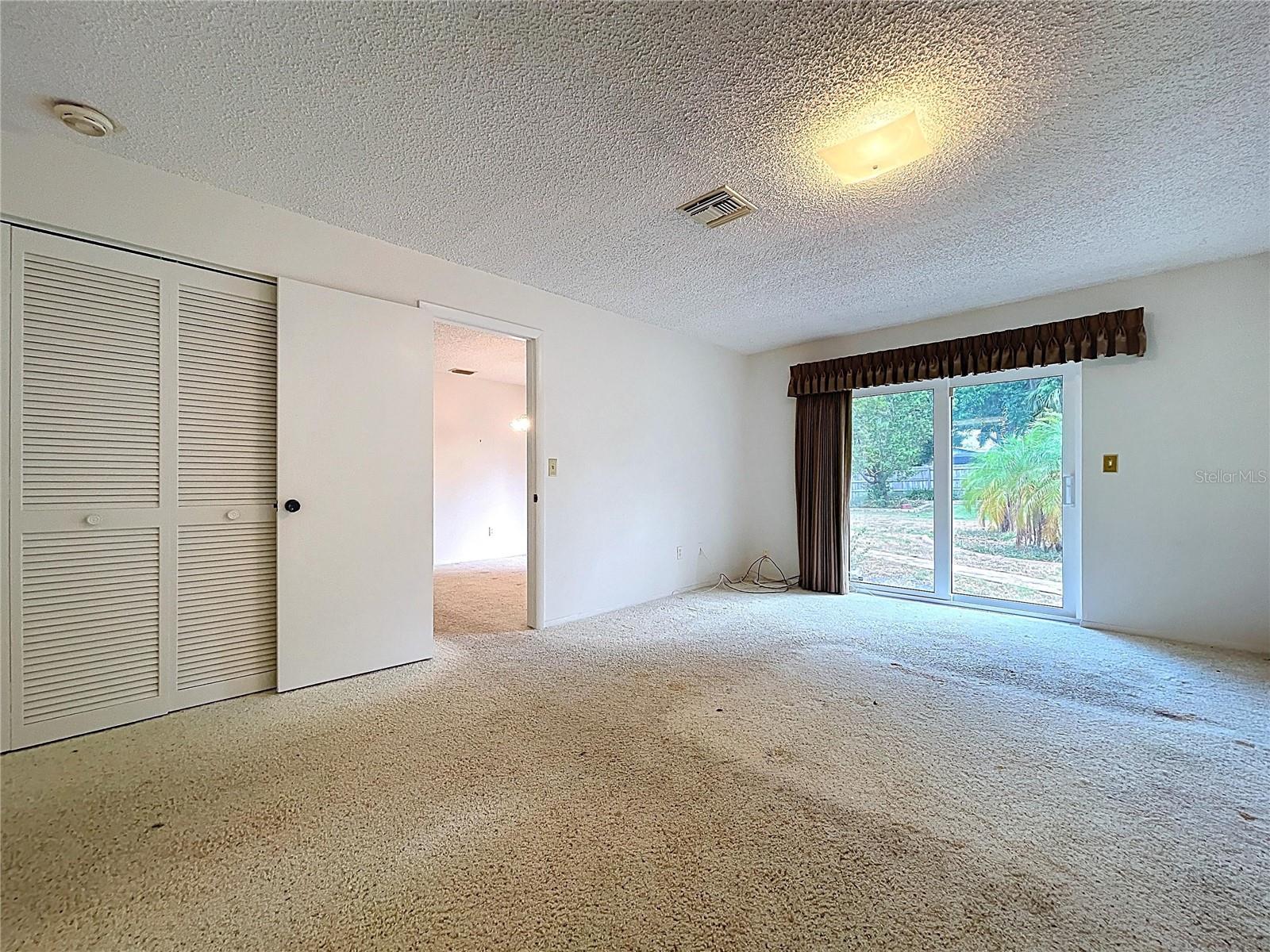 Primary suite offers three closets and 20 x 12 space.