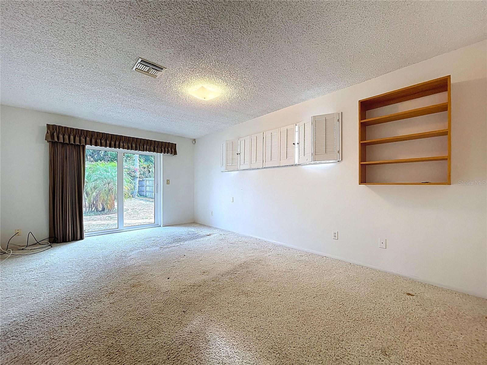 Ample natural light through double pane windows and sliding glass door.