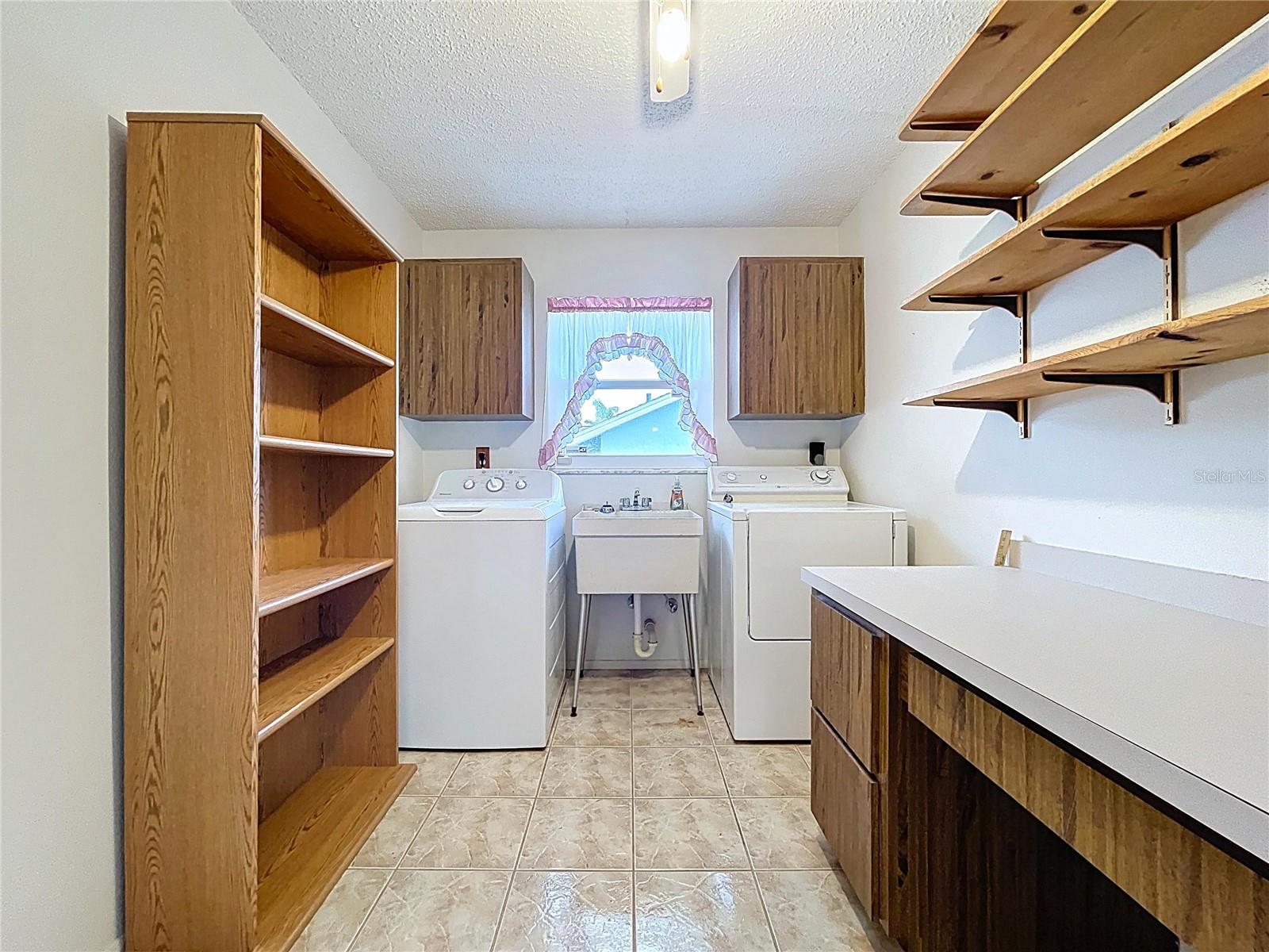 The inside laundry room offers space as a mud room right off of the garage.