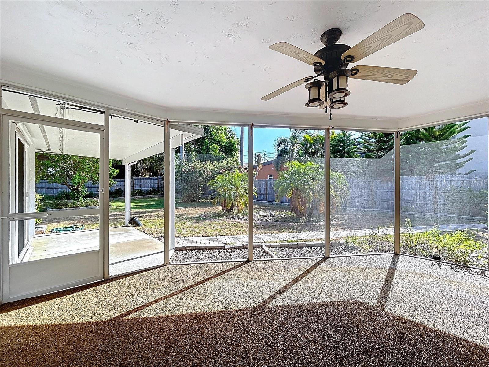 Screened patio offers a covered space to entertain and soak in the Florida weather.