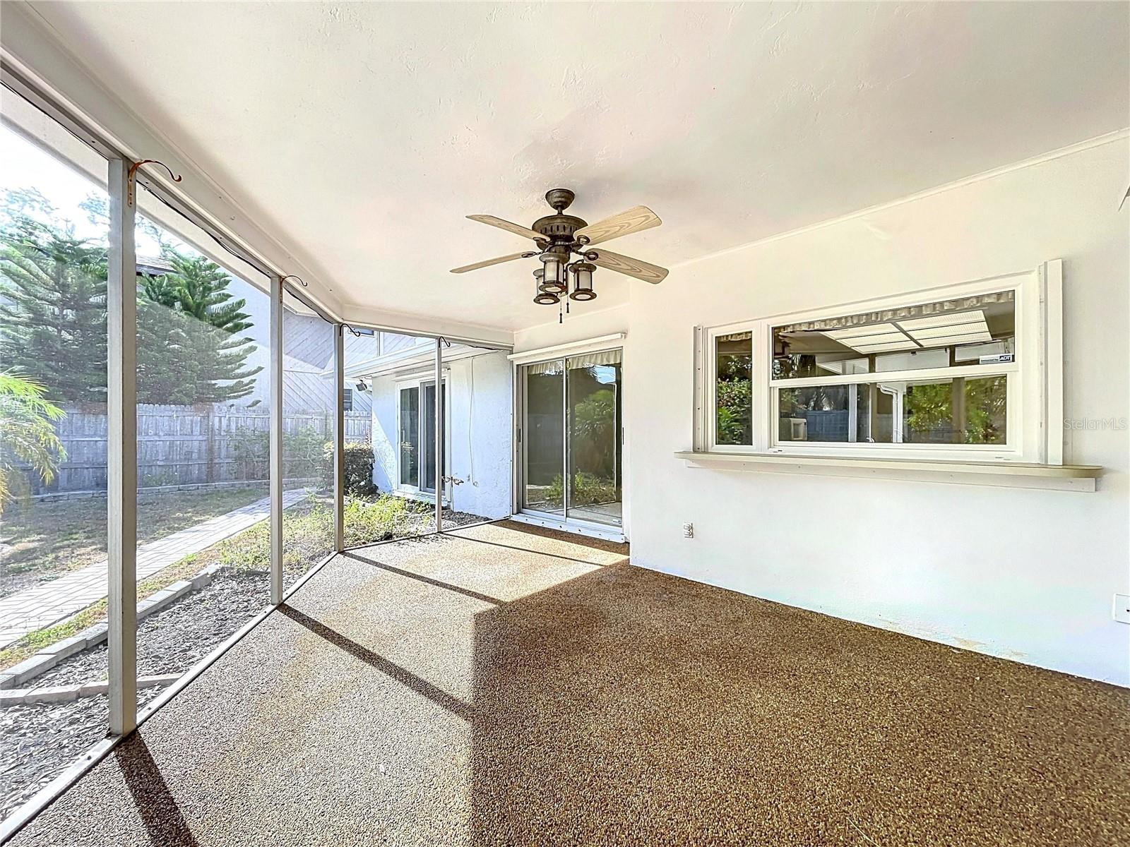 Screened patio offers a covered space to entertain and soak in the Florida weather.