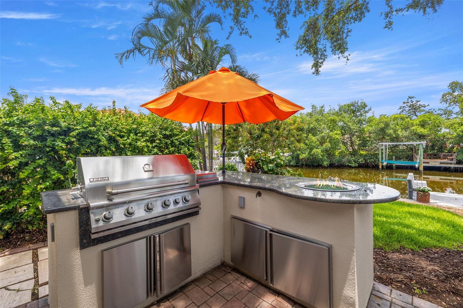 Outdoor kitchen with gas for grill, burner and fire pit