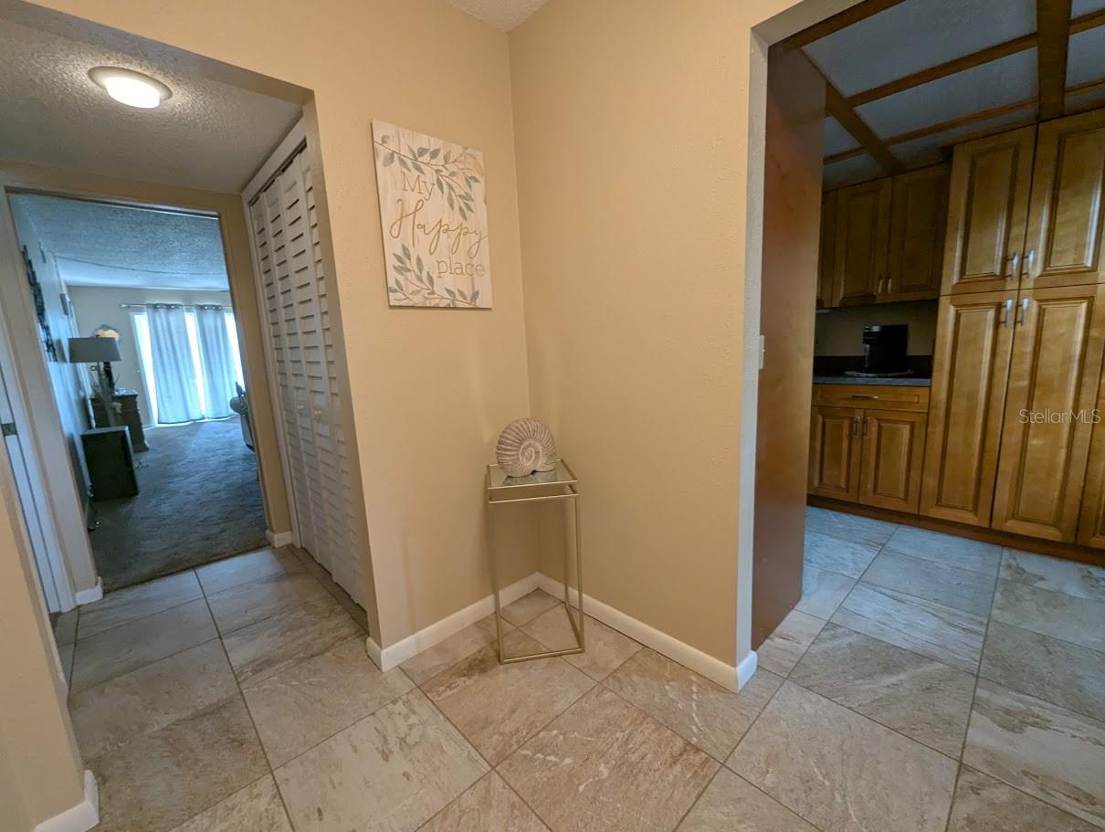 View from entry door of foyer, kitchen and great room
