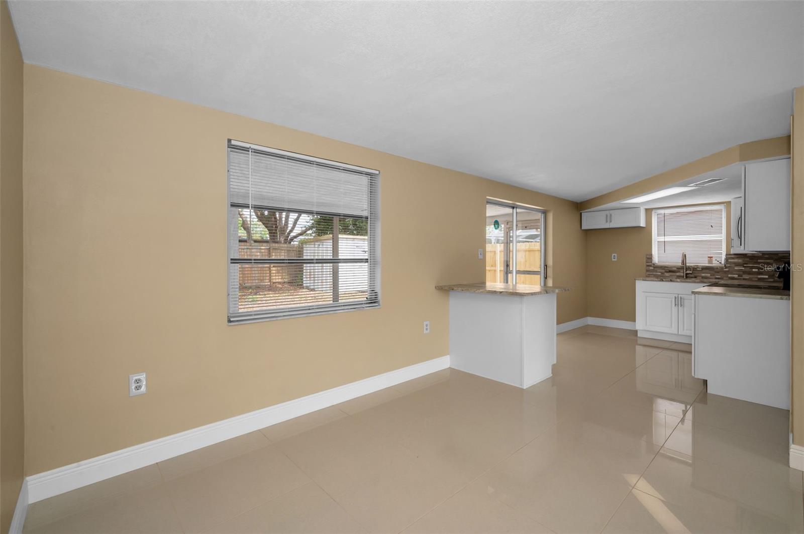 Dining room area looking into kitchen