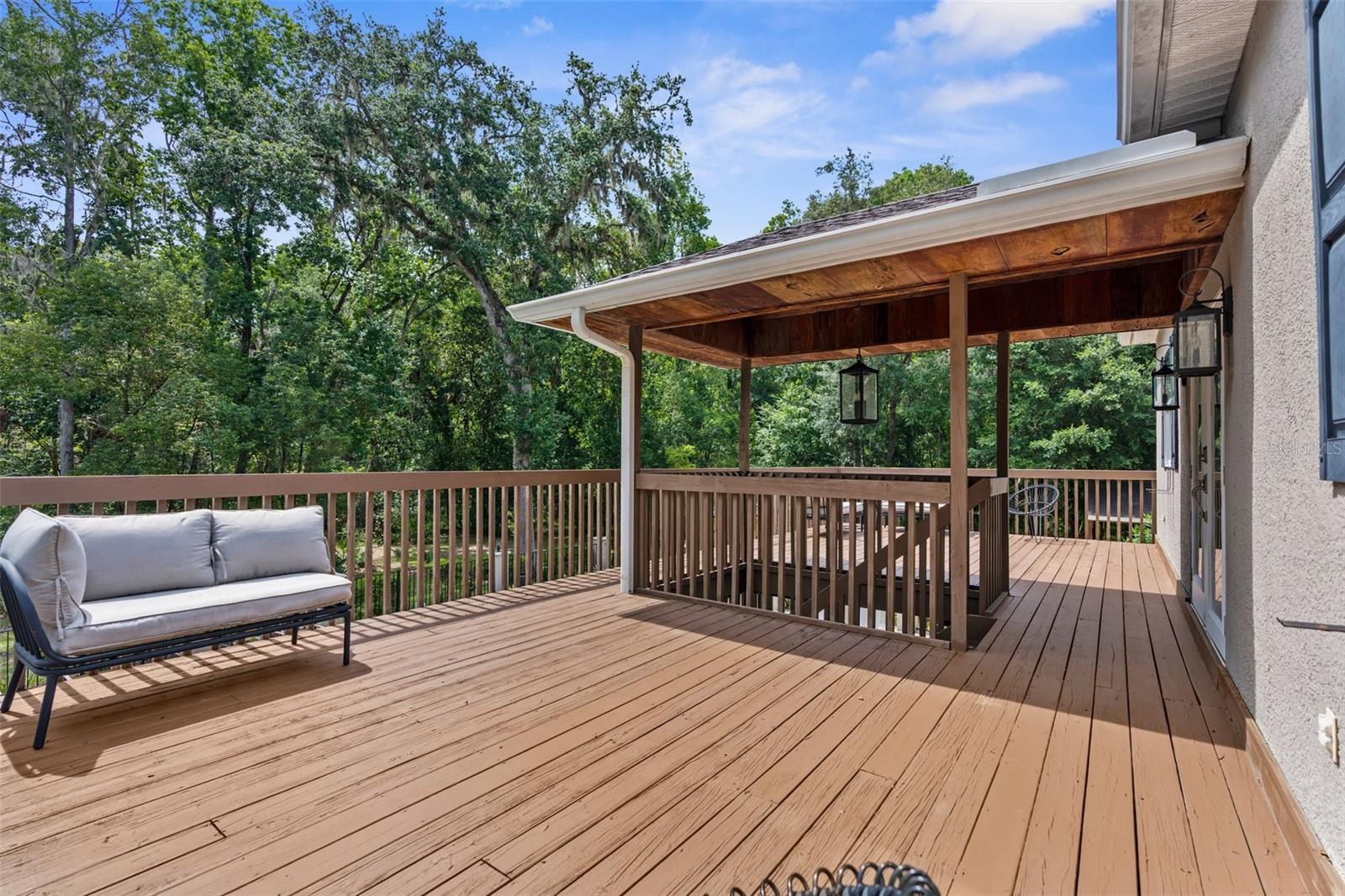 Upstairs deck overlooking pool.