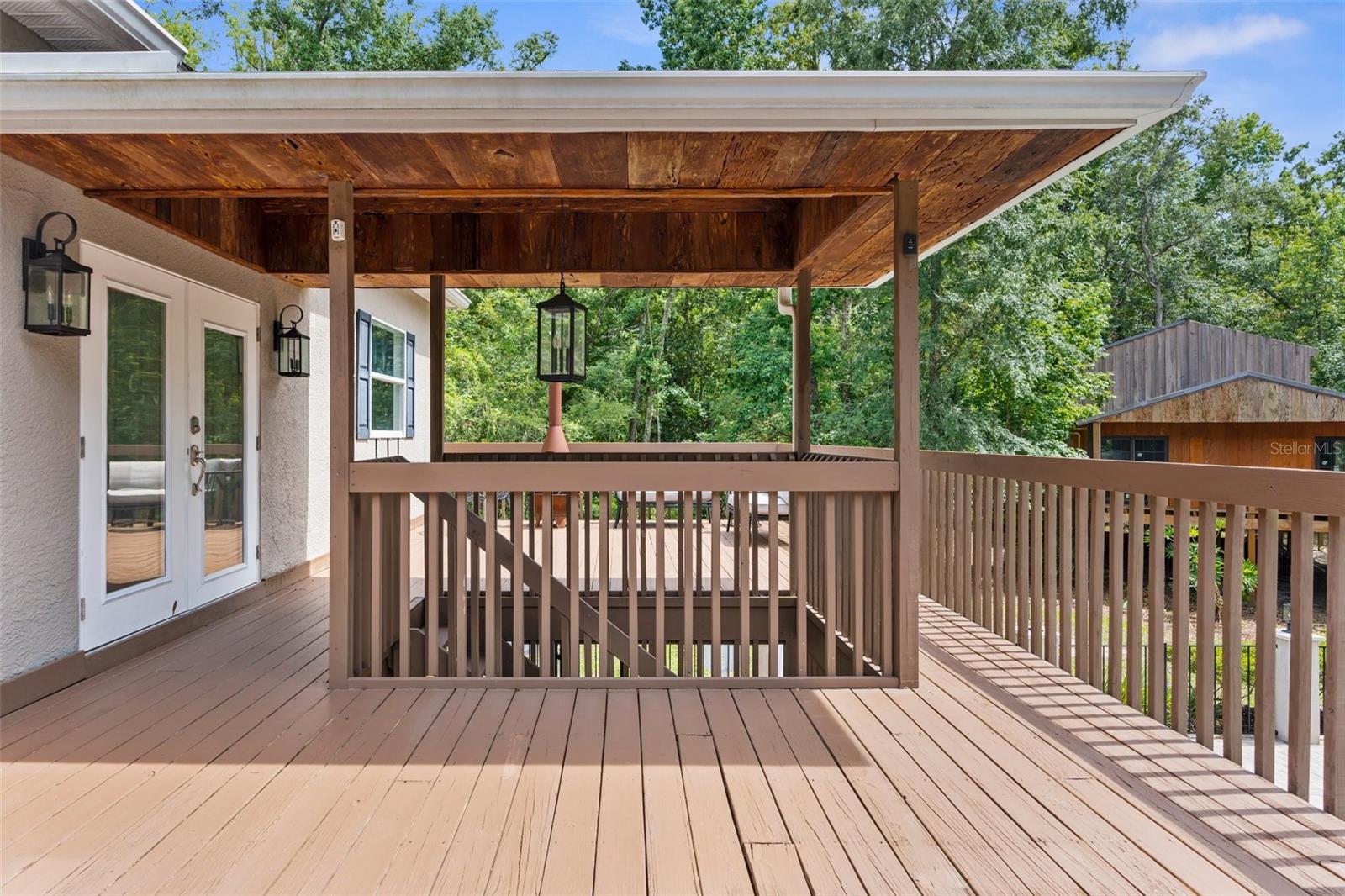 Upstairs deck overlooking pool.