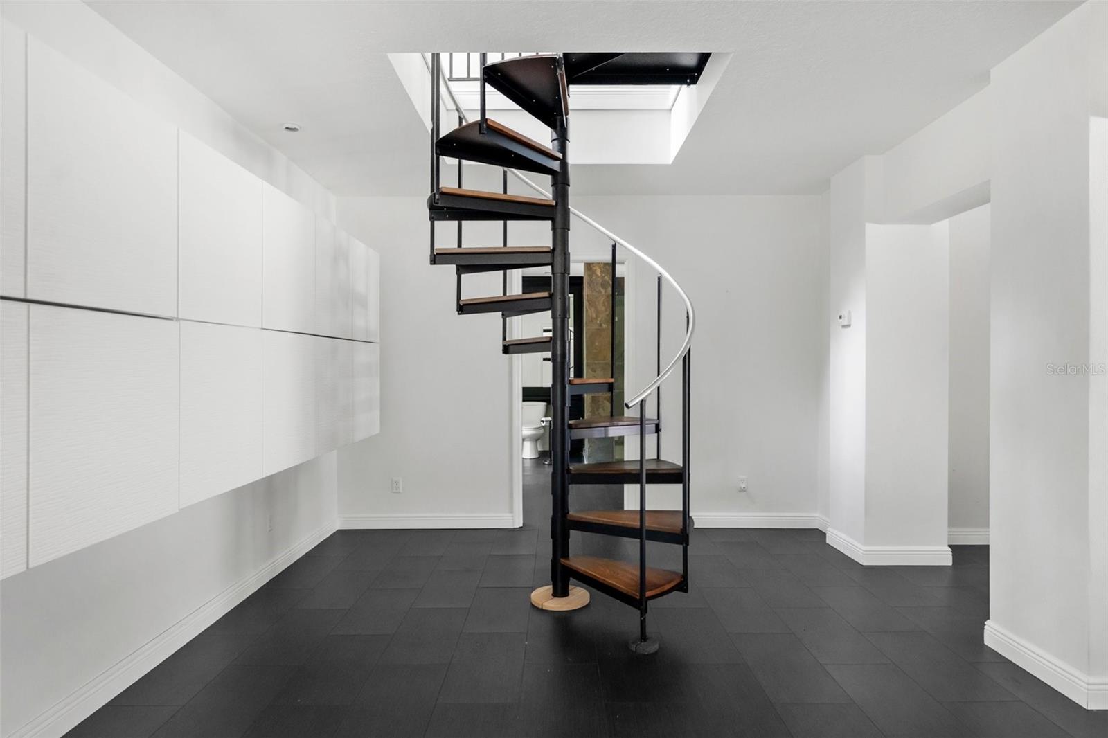 Downstairs with 2 sets of sliders to the pool.
