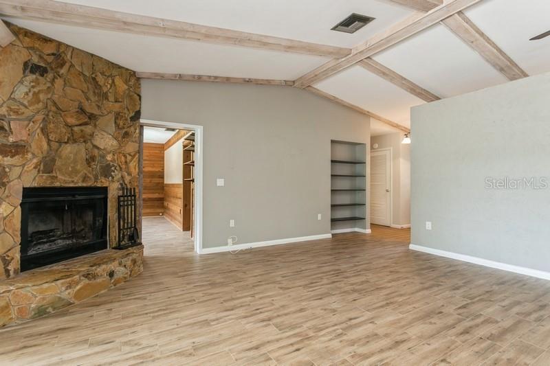 Entrance to office/den to right of fireplace