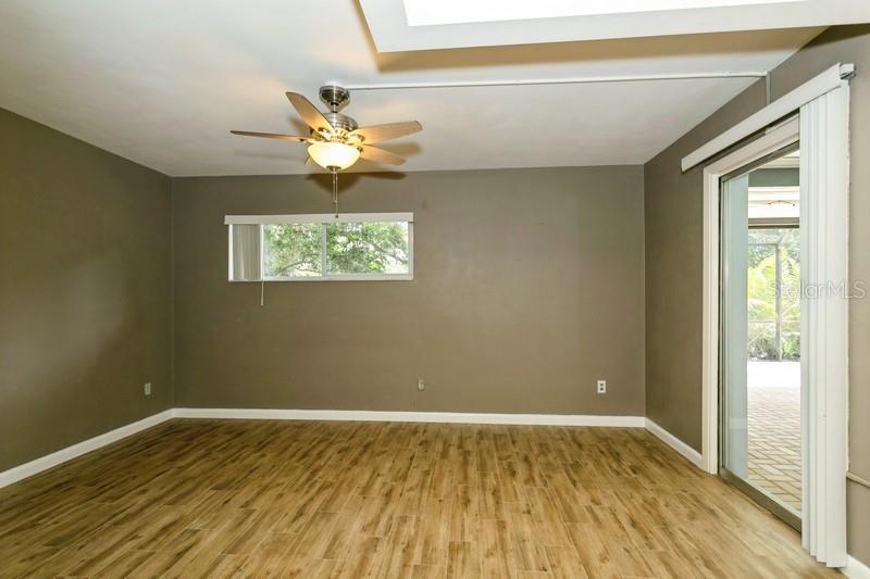 Primary bedroom with sliders to pool deck