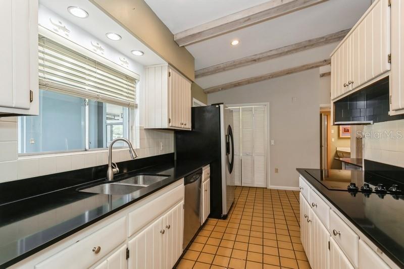 Galley kitchen sink faces front porch