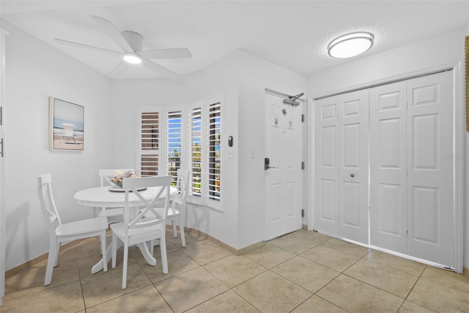 Entry and Dining area near bay windows with plantation shutters