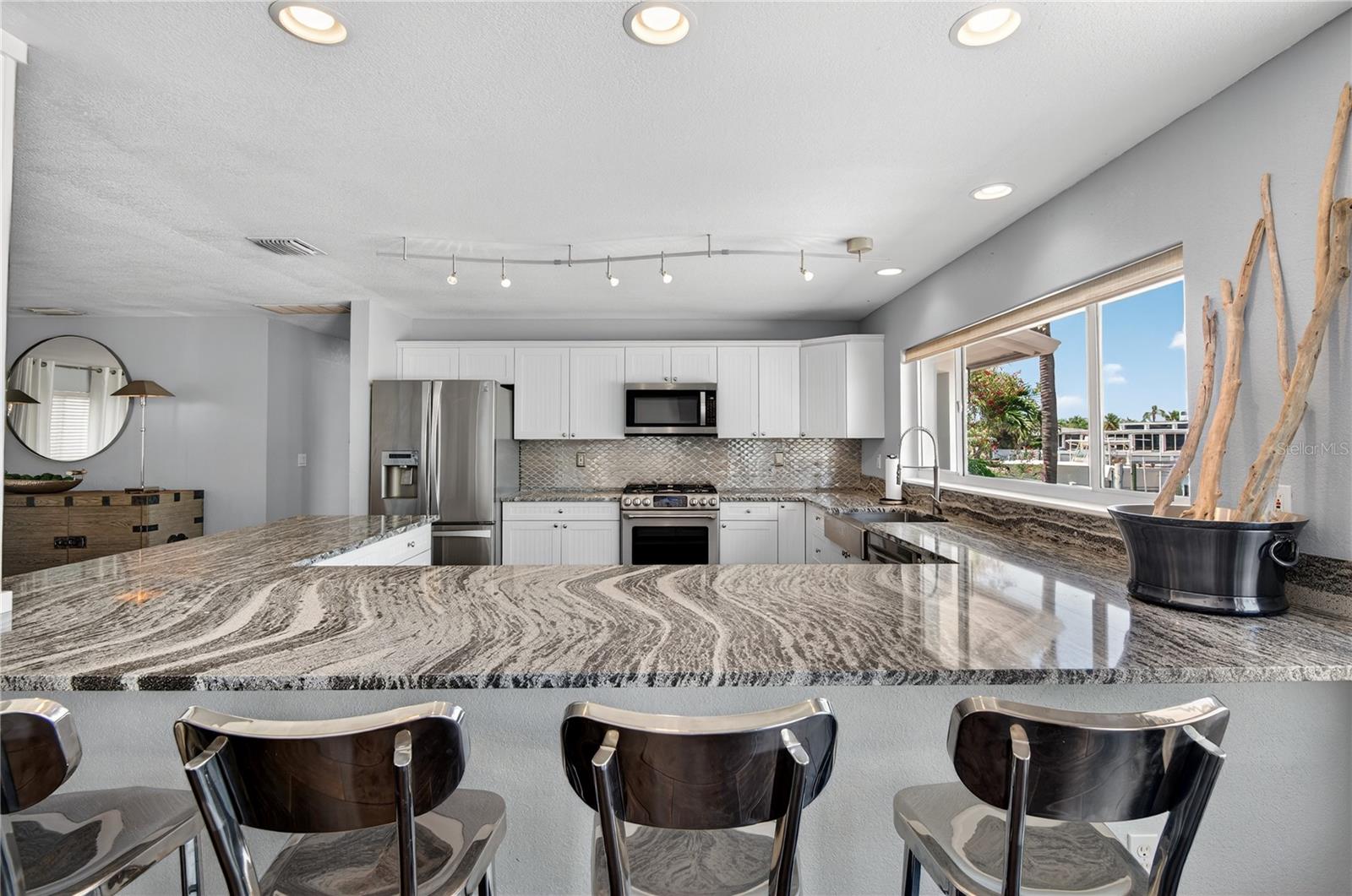 The Kitchen is open, large and has plenty of counter space for entertaining