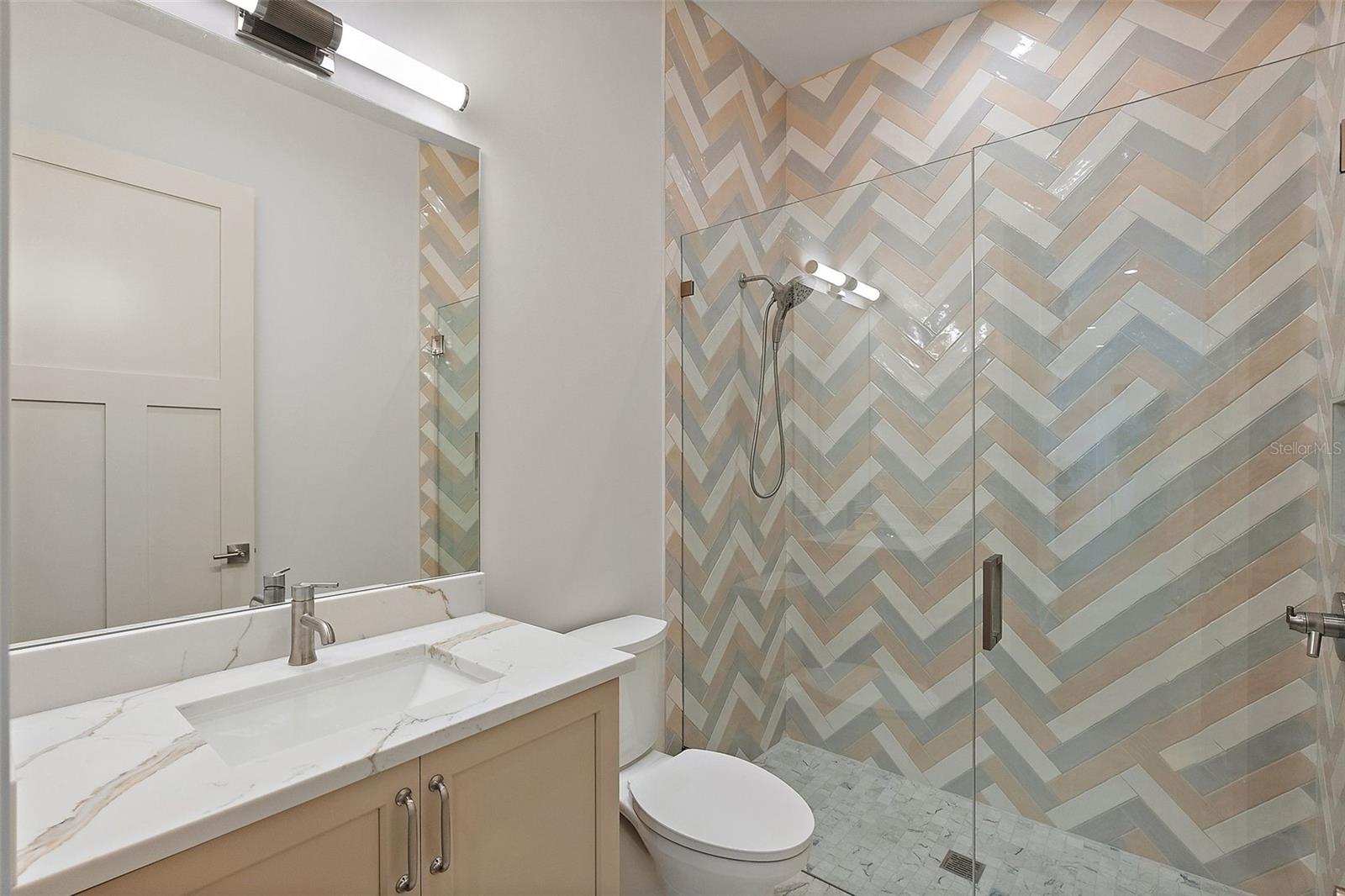 Downstairs Full Bathroom located next to the 5th Bedroom