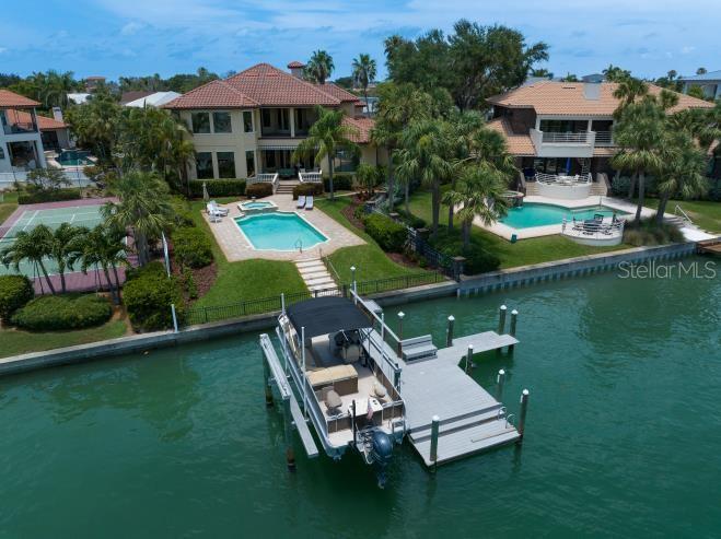 Dock with electric and water.  Tritoon negotiable as part of sale