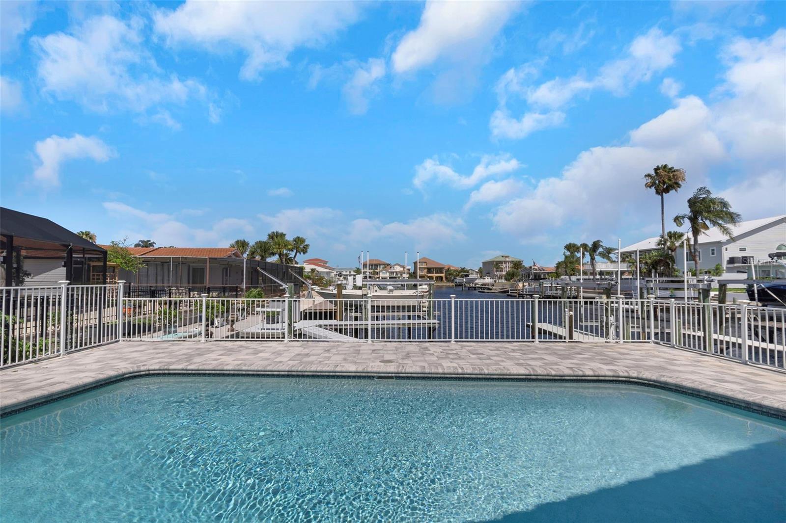 Relax in your waterfront pool.