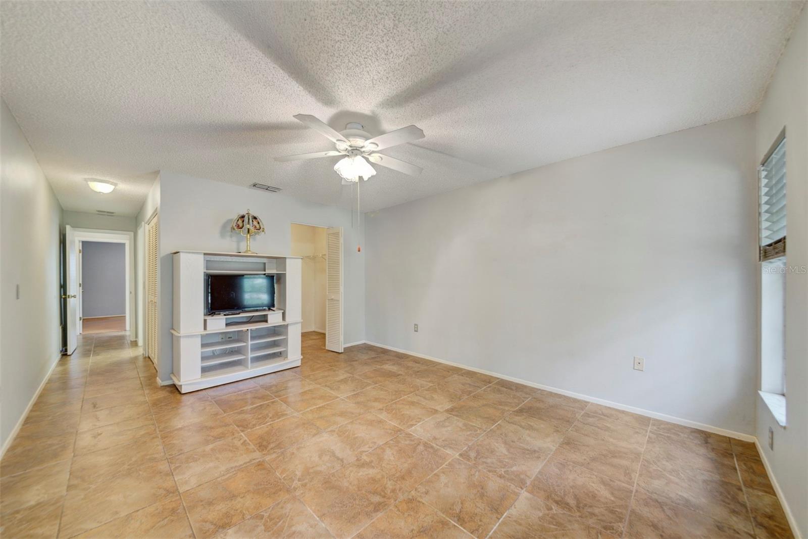 Back bedroom, closet, hallway with full bath and large closet