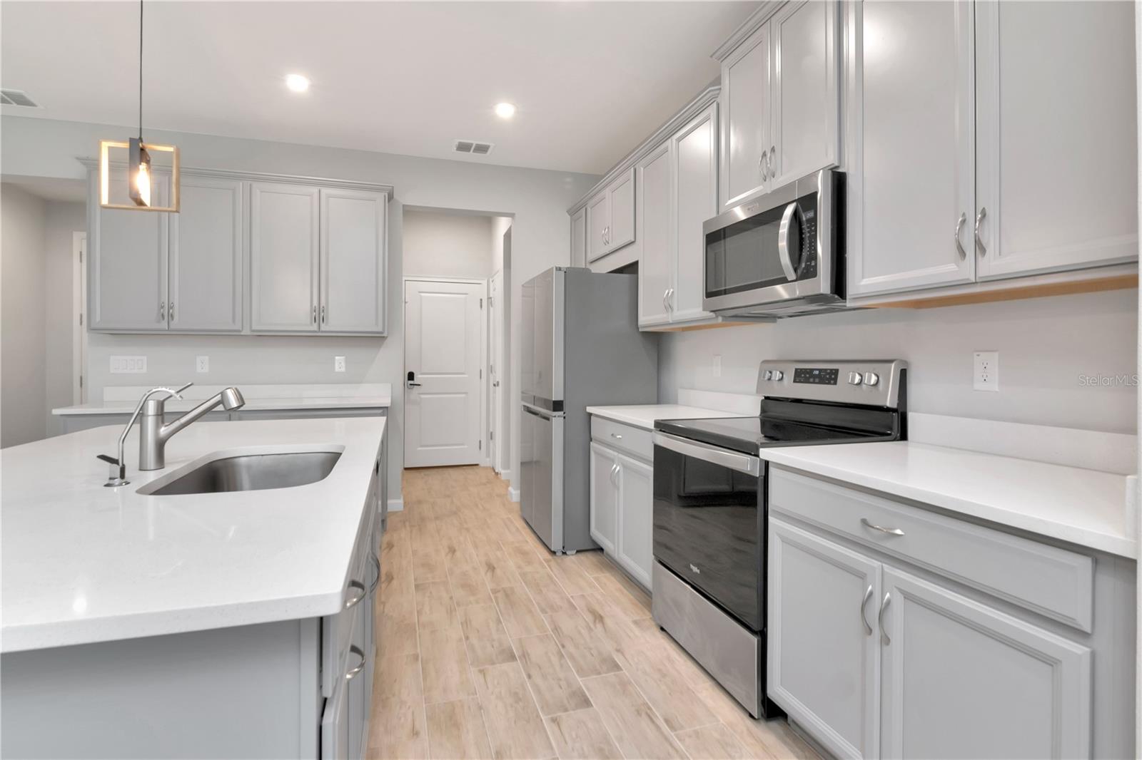 Kitchen with Large Island and Stainless Steel Appliances