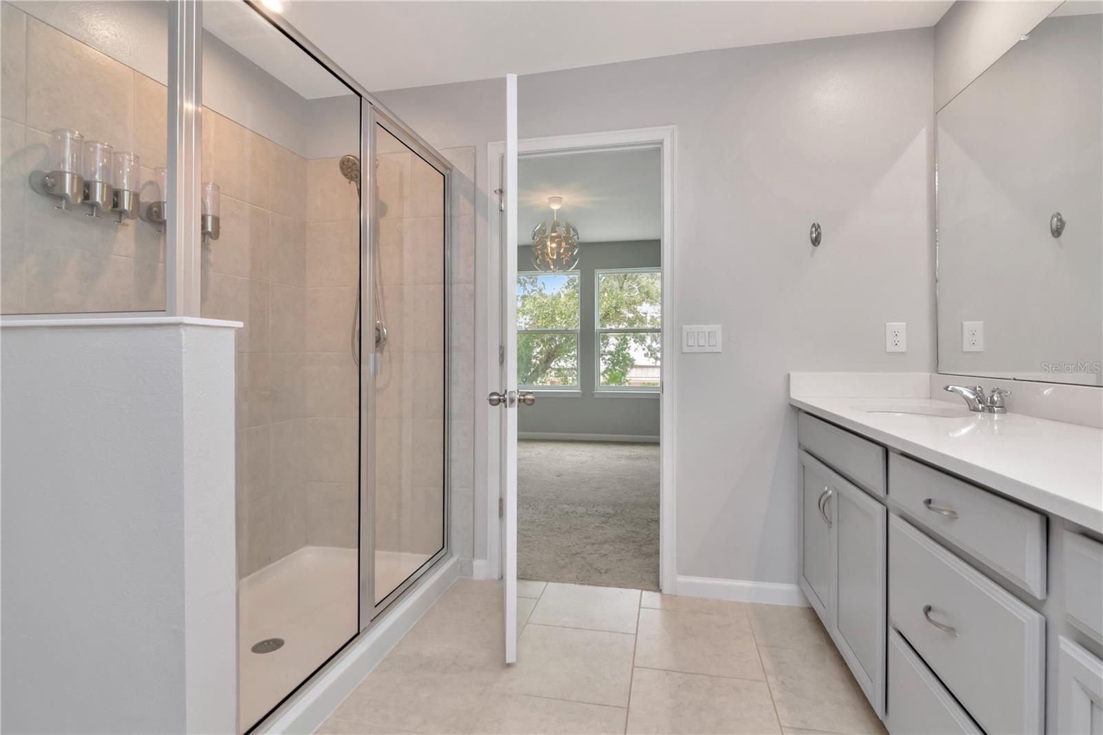 Primary Bathroom with Dual Vanities, Additional Walk In Closet, Walk In Shower