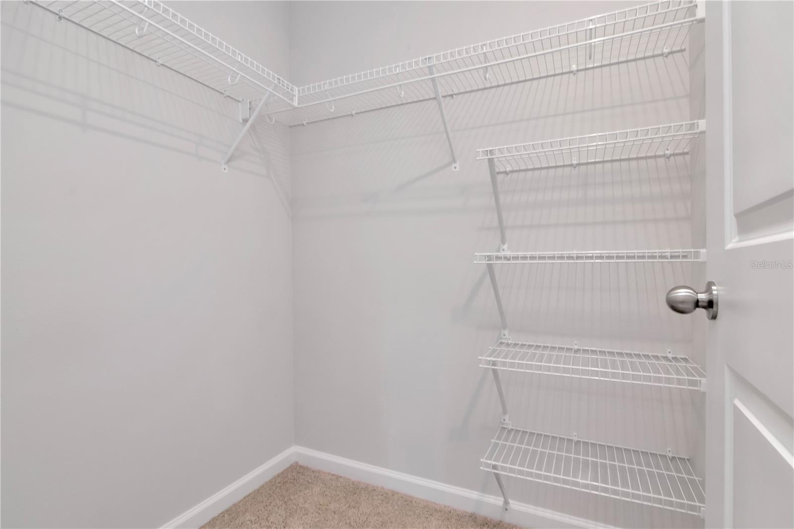 Primary Bathroom with Dual Vanities, Additional Walk In Closet, Walk In Shower