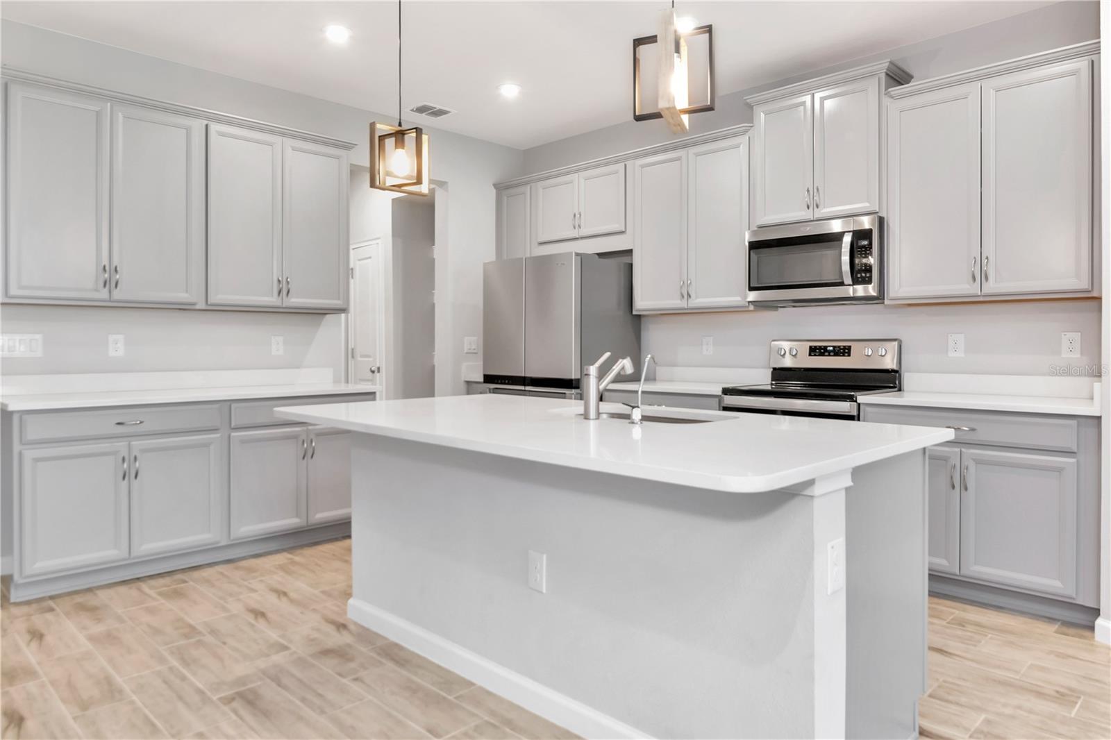 Kitchen with Large Island and Stainless Steel Appliances
