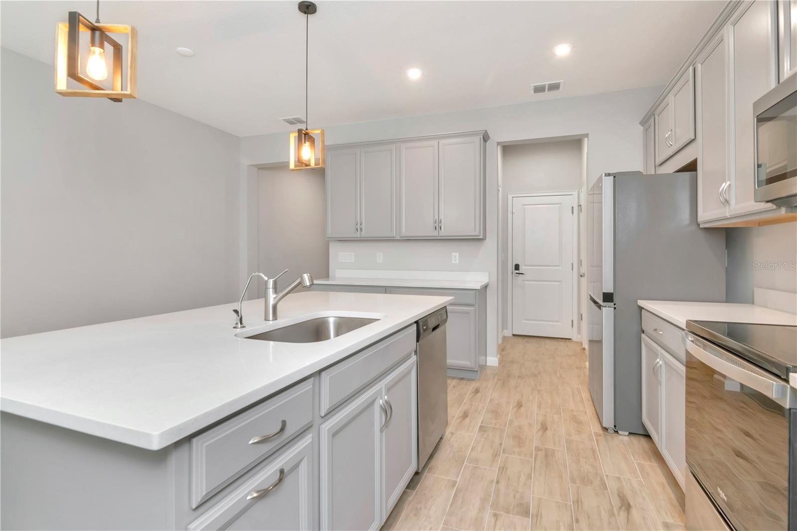 Kitchen with Large Island and Stainless Steel Appliances