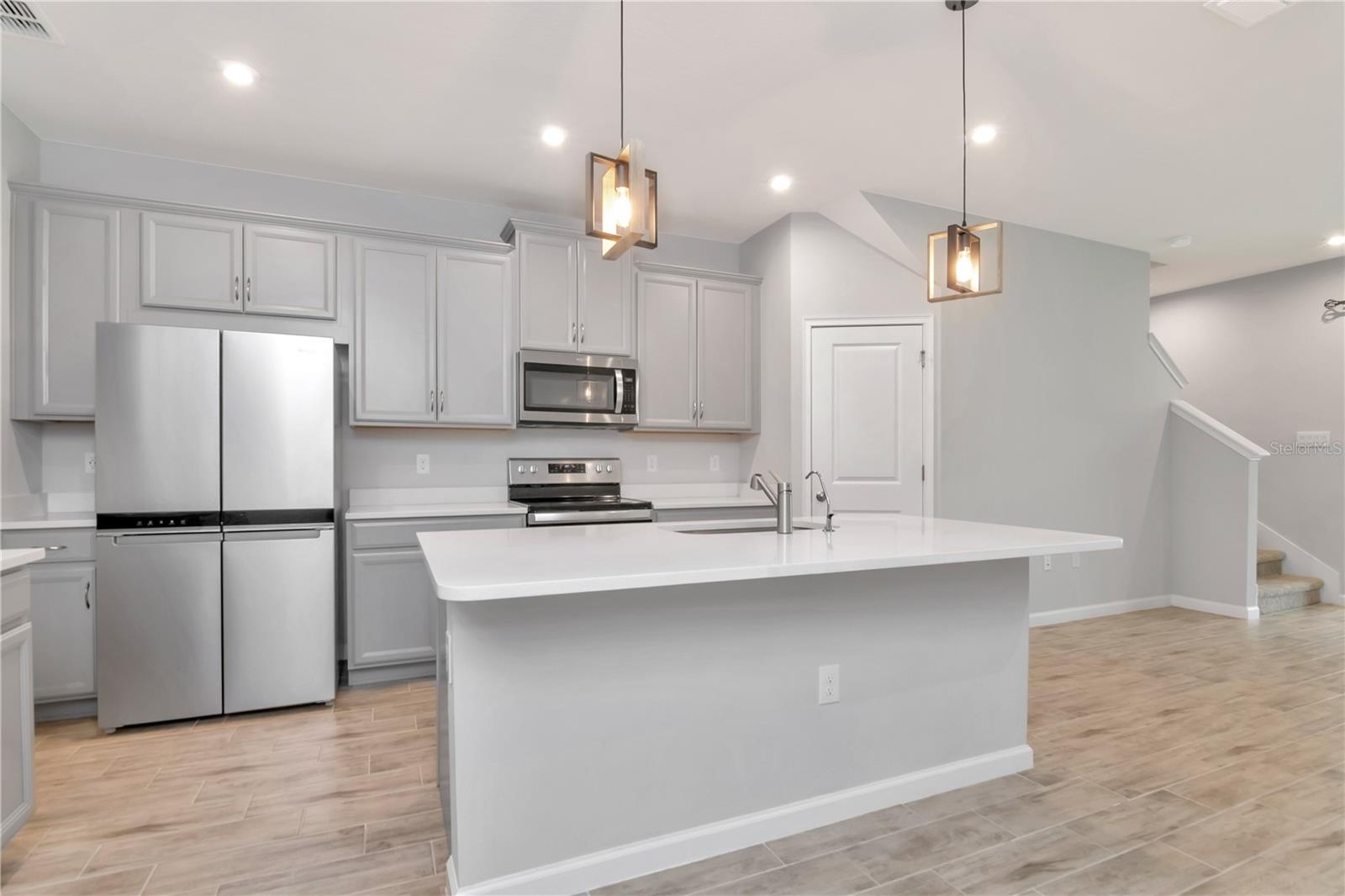 Kitchen with Large Island and Stainless Steel Appliances