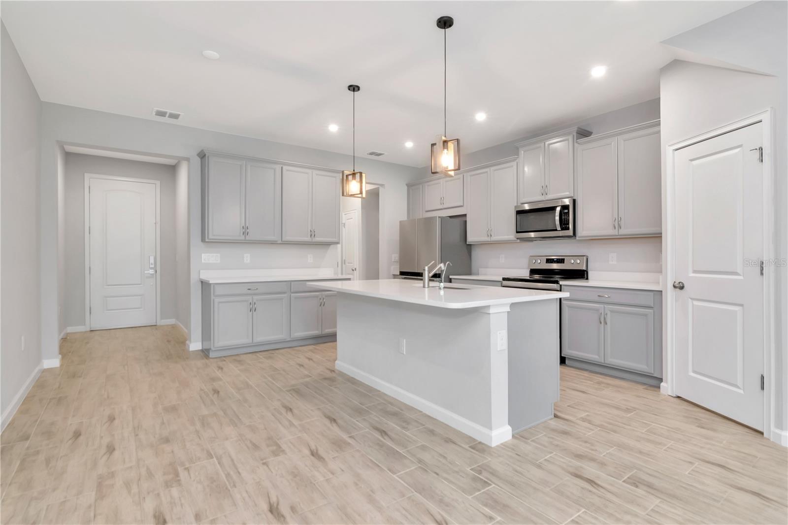 Kitchen with Large Island and Stainless Steel Appliances