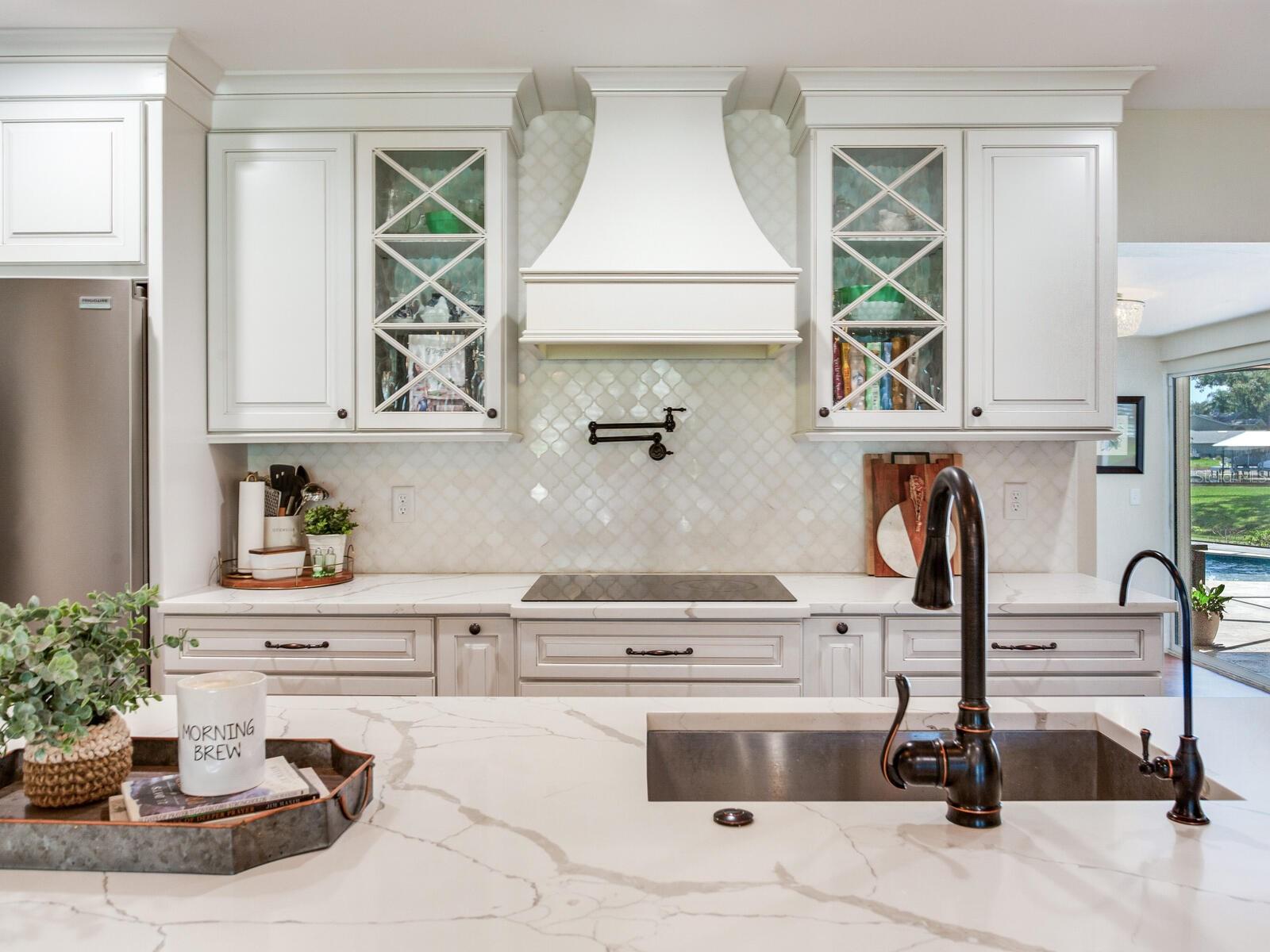 Kitchen / Cabinets with Crown Molding / Vent Hood