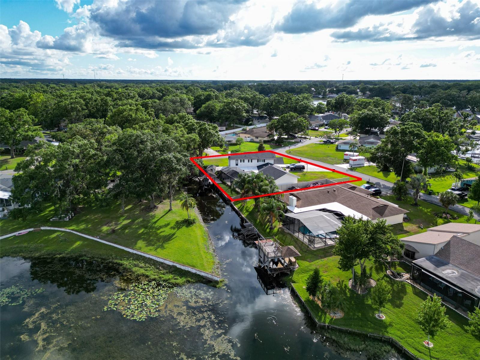 Aerial Canal View Red Outline of Property