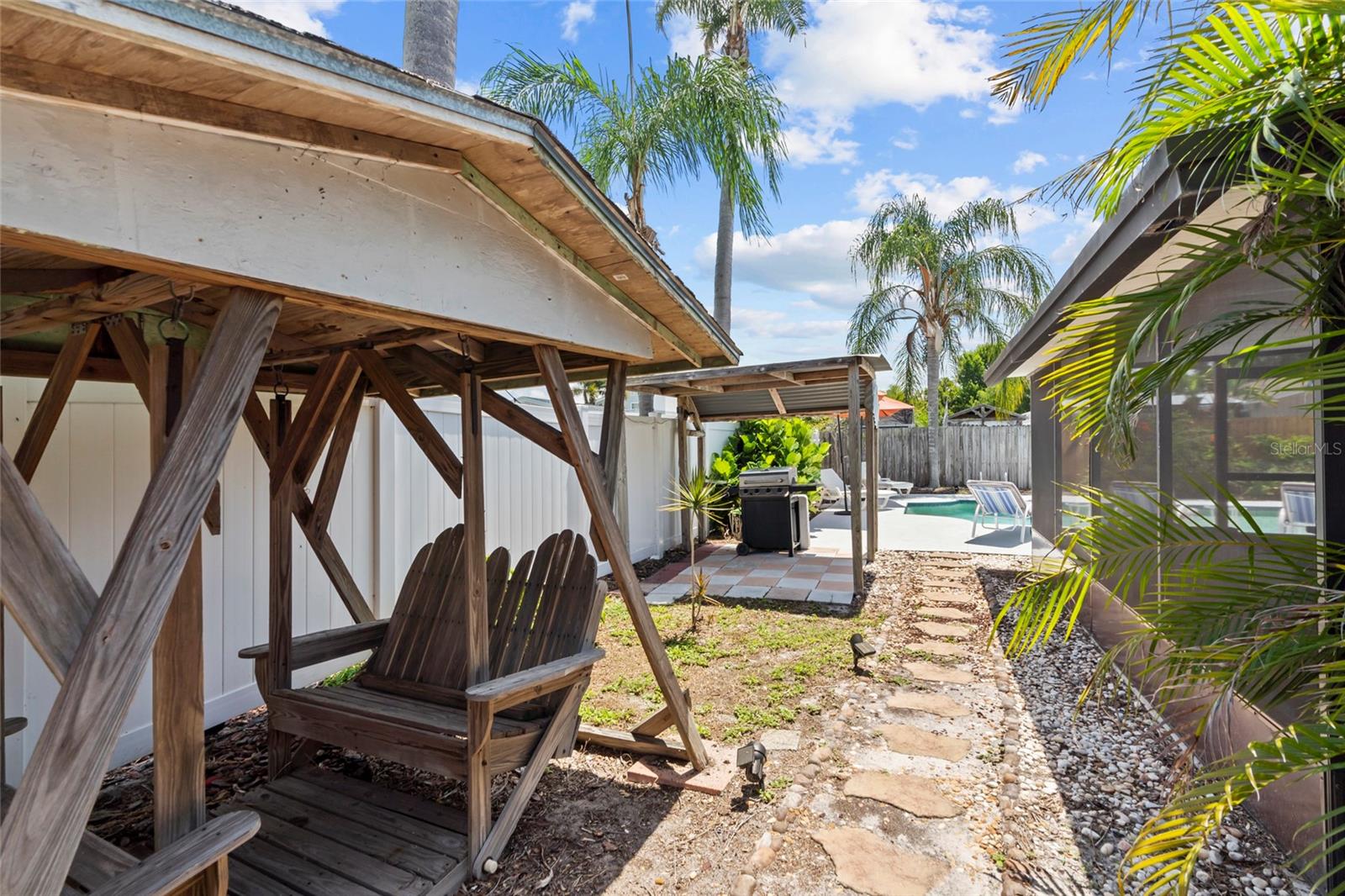Backyard with Swing Gazebo & Covered Grilling Area