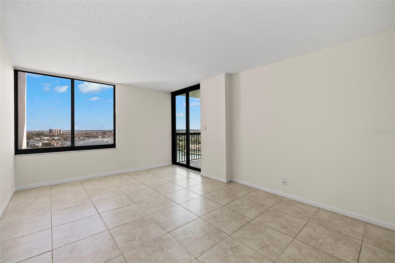 Primary bedroom with balcony access