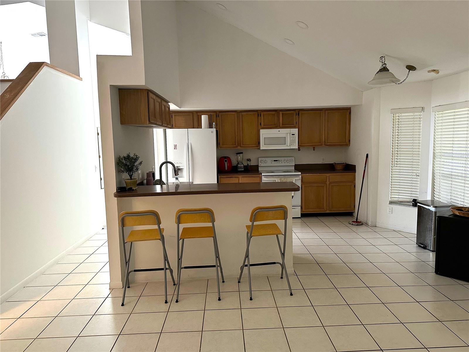 Open Kitchen with acess to outdoor enclosed patio area.