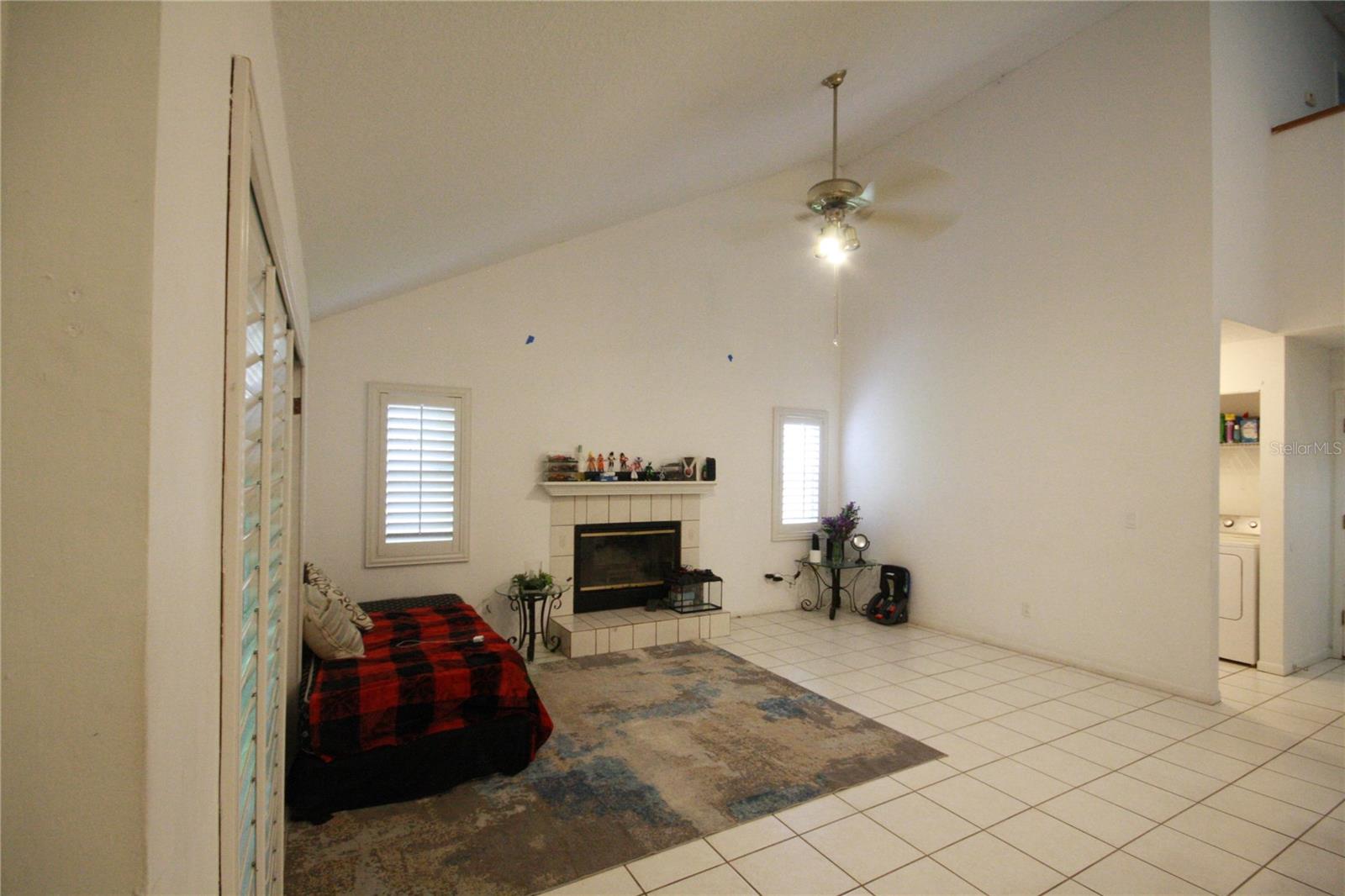 Fireplace with sliding patio doors leading to backyard.