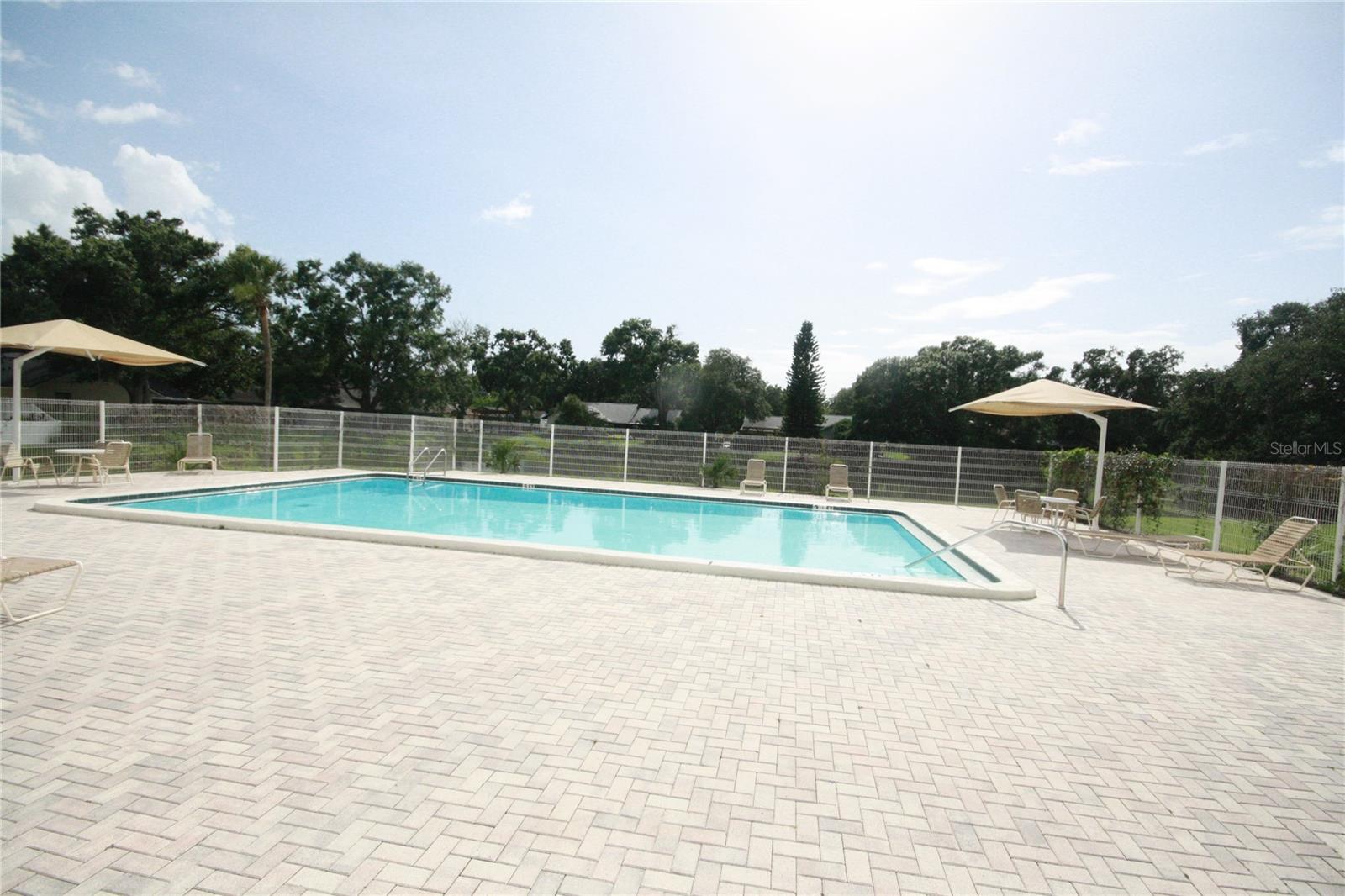 Community Pool Located across the street from the home.