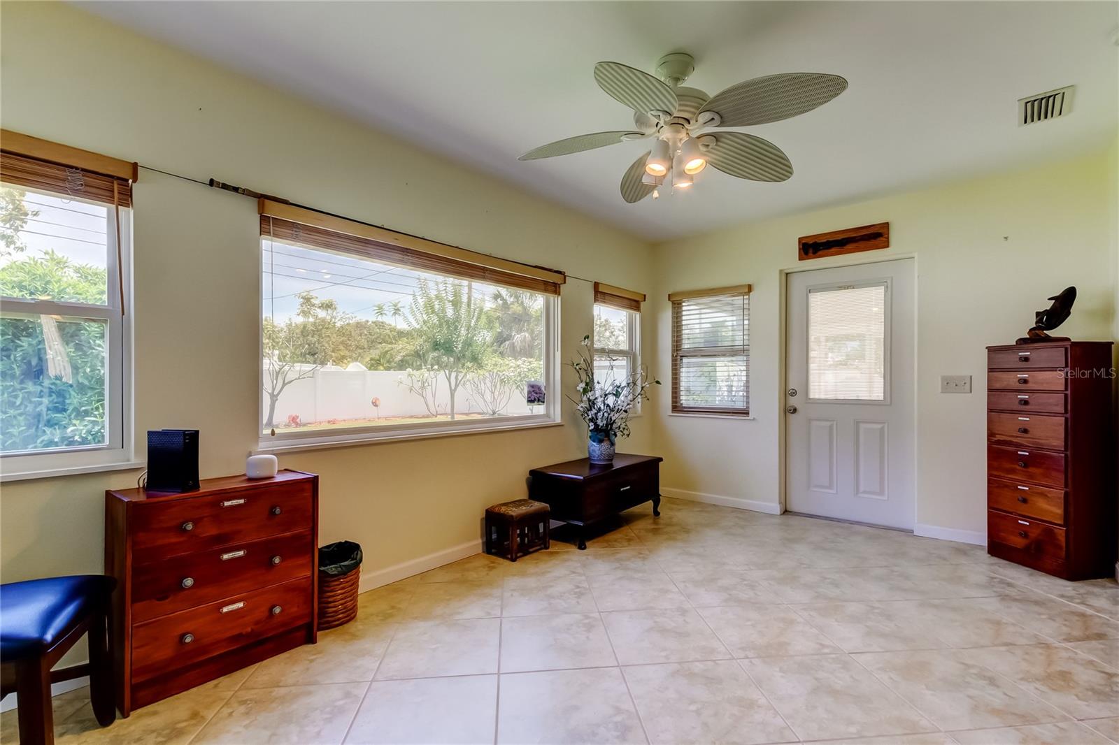 Bright family room opens to screened porch