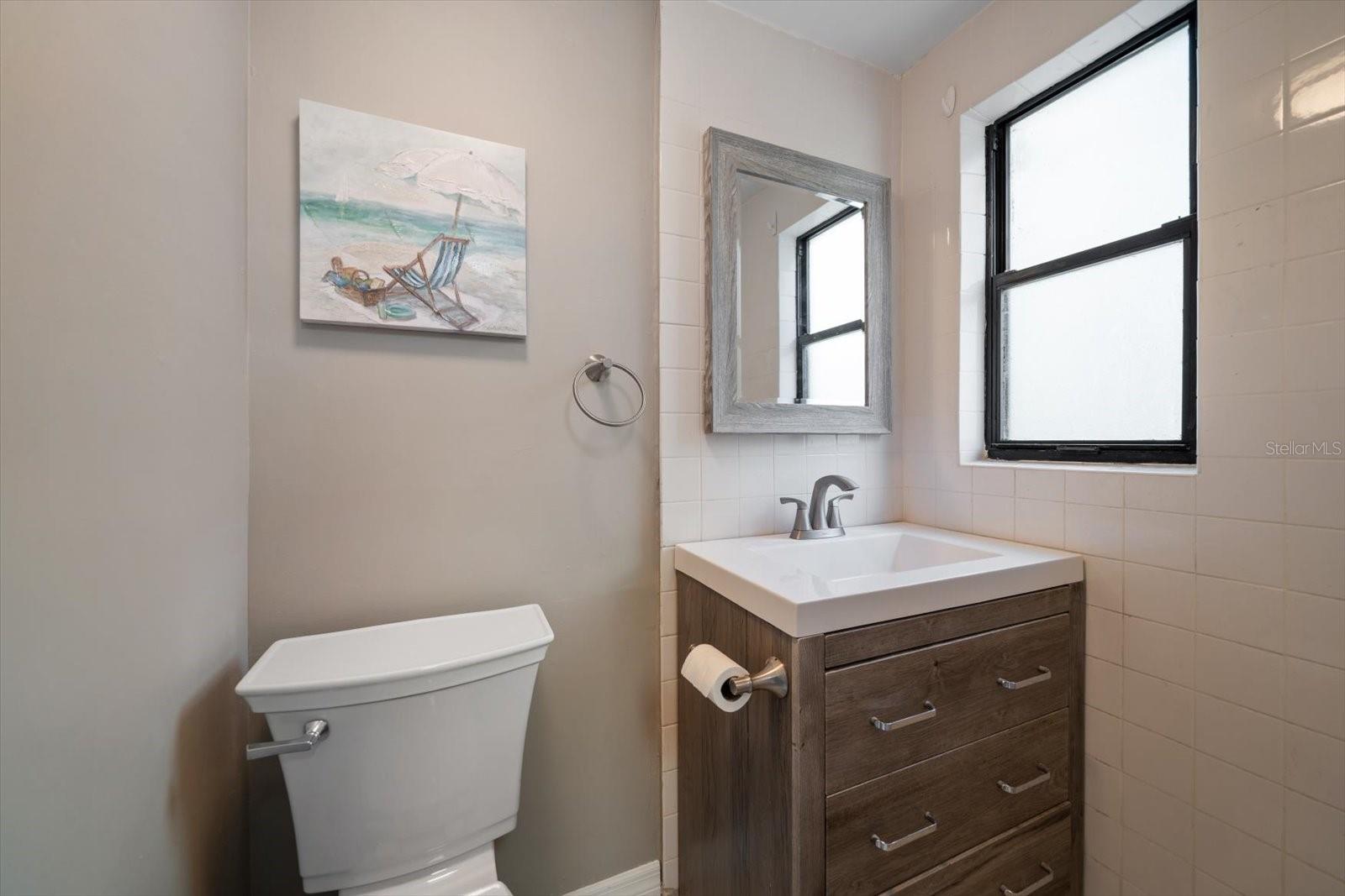 1/2 Bath located near Laundry Area