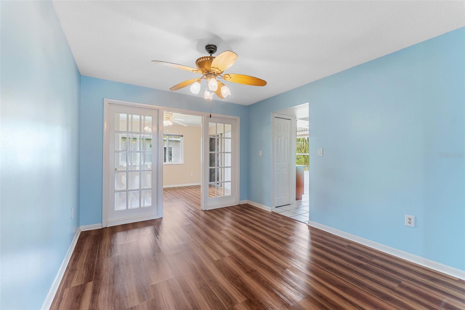 dining room towards family room in back and kitchen on right