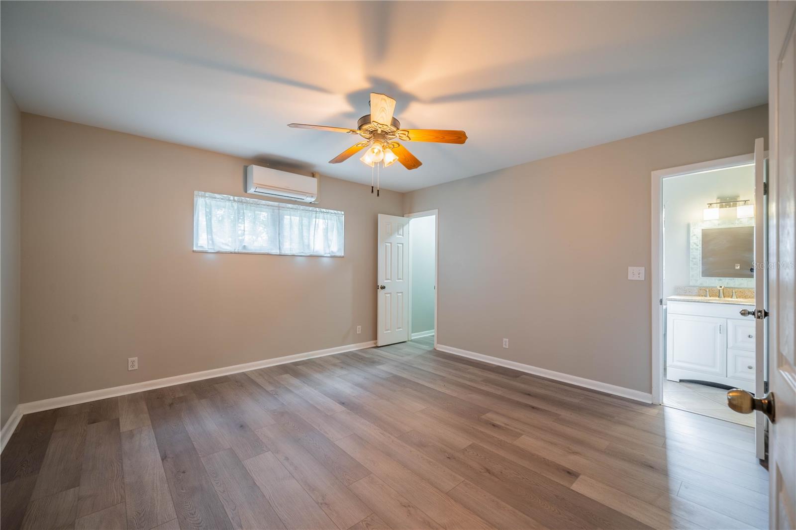 Master bedroom with walk-in closet and bathroom