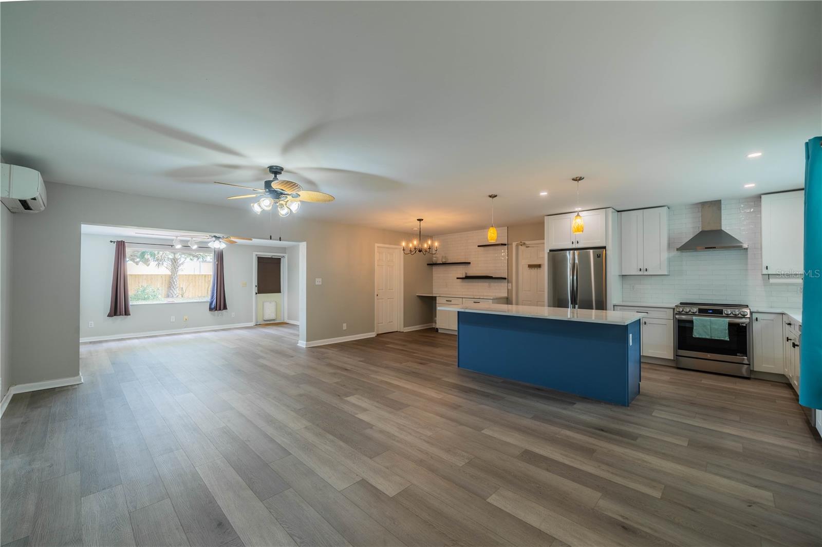 Living room looking at the Florida room and Kitchen. Beautiful open design, perfect for entertaining!
