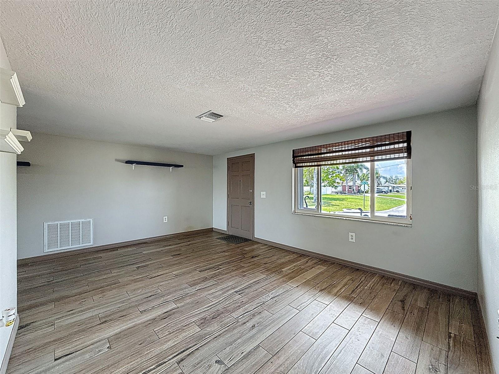 NOTICE THE BARN WOOD LOOK TILE FLOORING