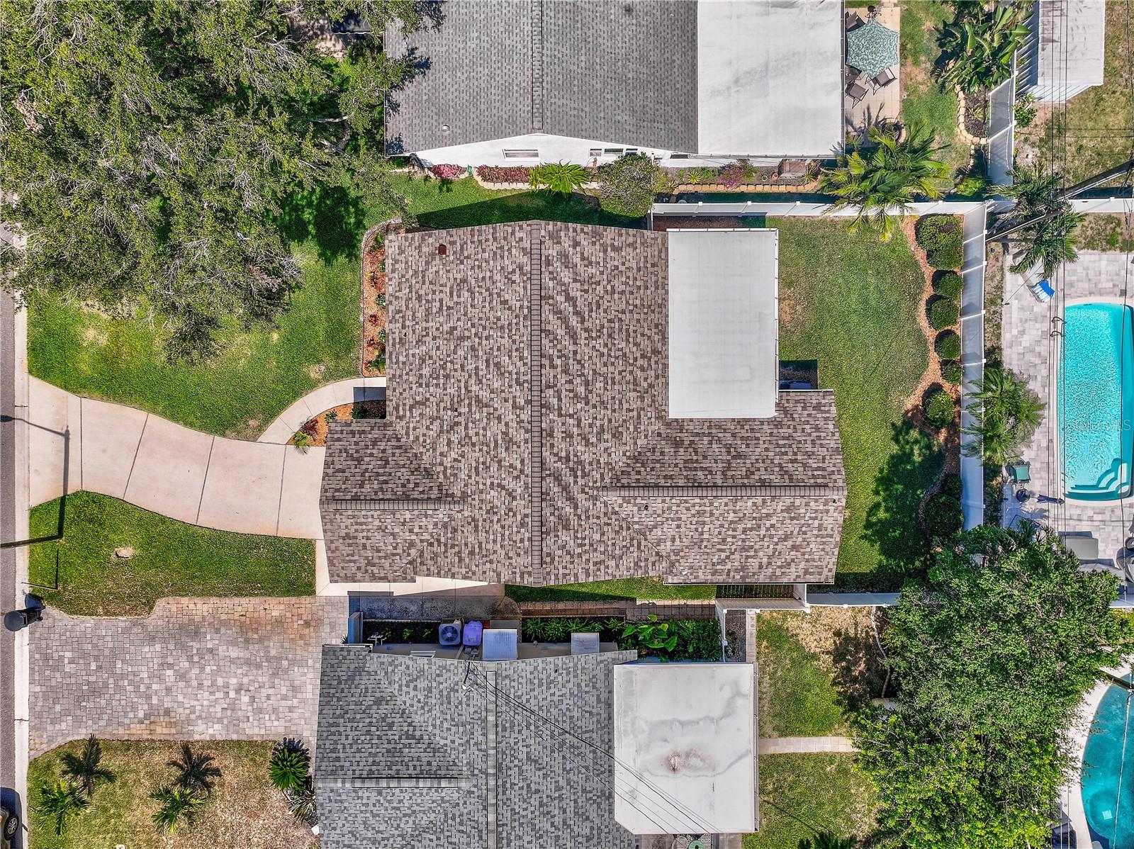 Aerial view of new roof and back yard.