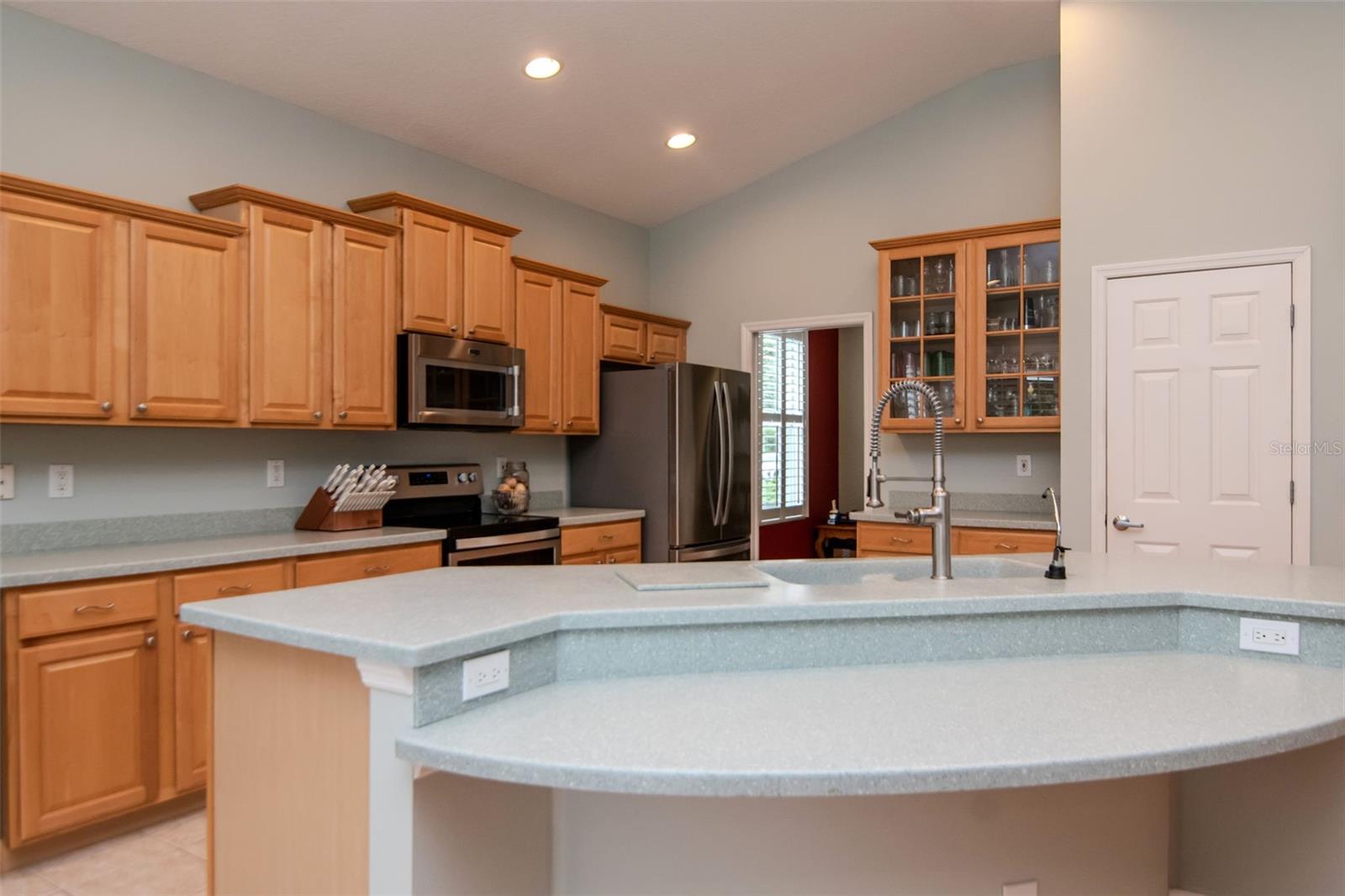 Spacious kitchen with large island and closet pantry.
