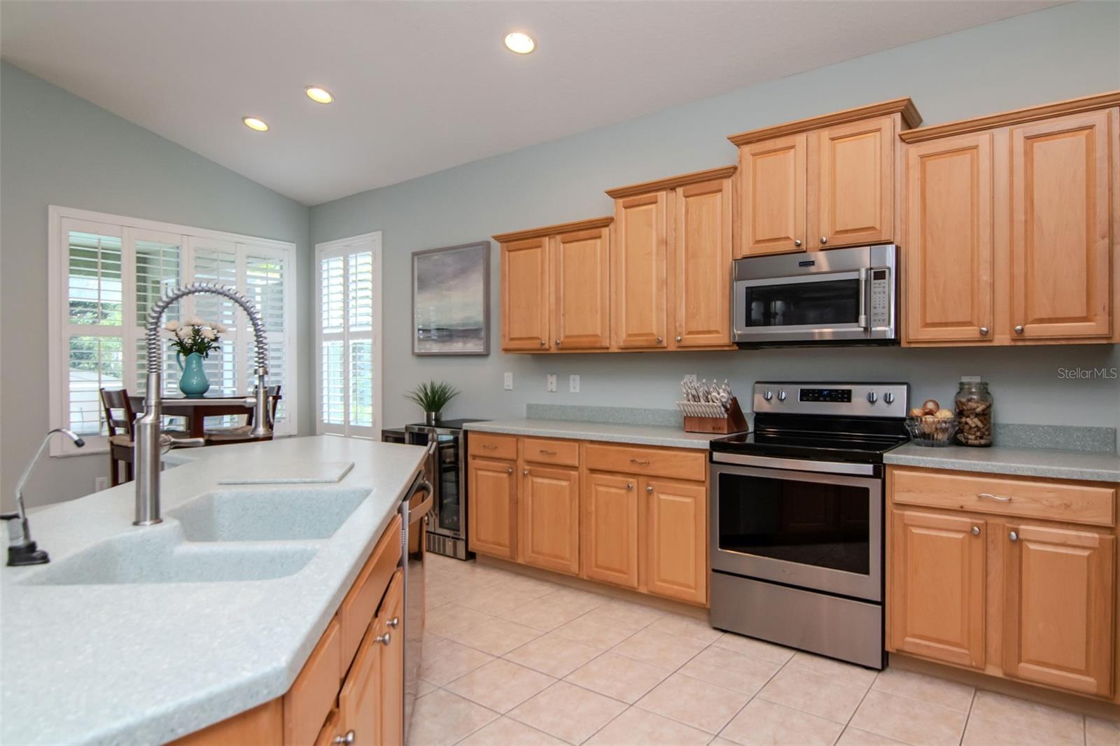 Kitchen and Dinette overlook the Pool area.
